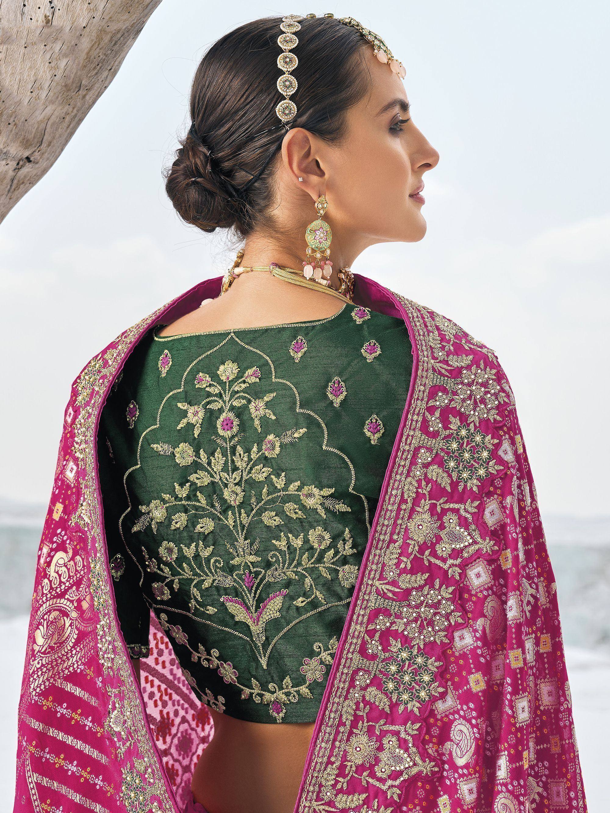 Green embroidered blouse with pink dupatta, Indian ethnic wear, floral design, traditional jewelry