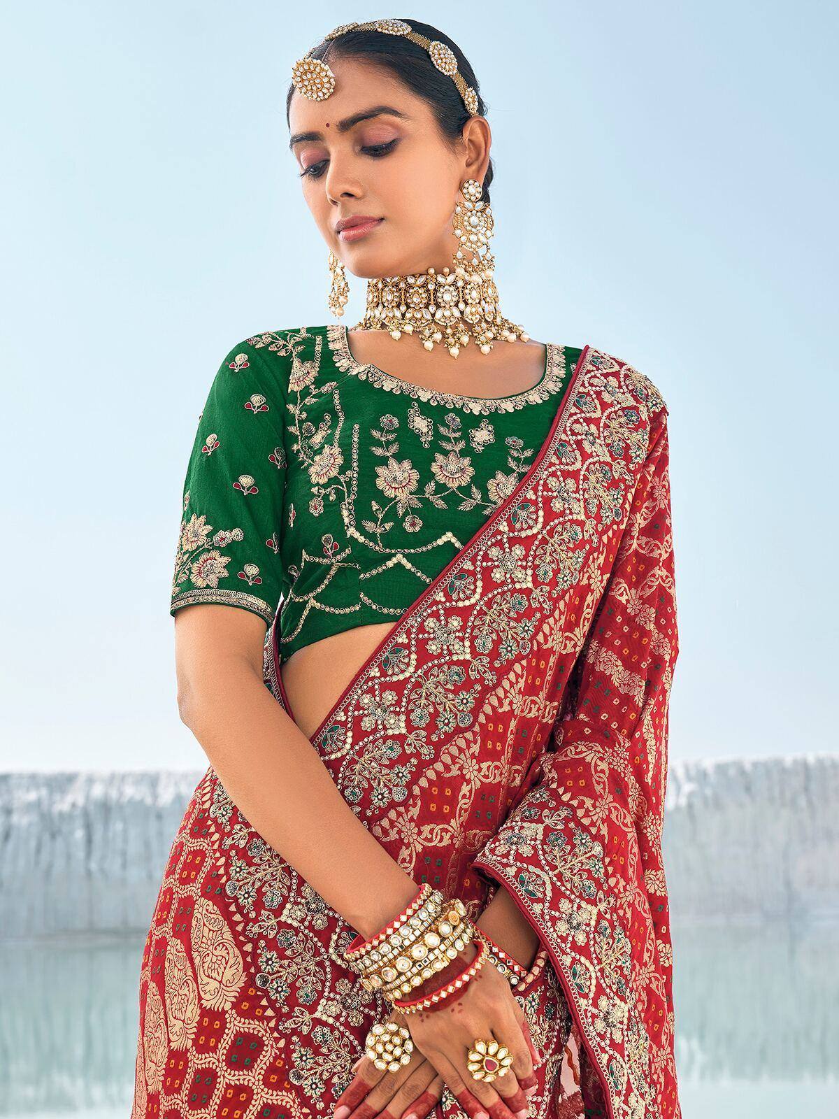 Green embroidered blouse with red floral saree, traditional Indian ethnic wear, designer jewelry