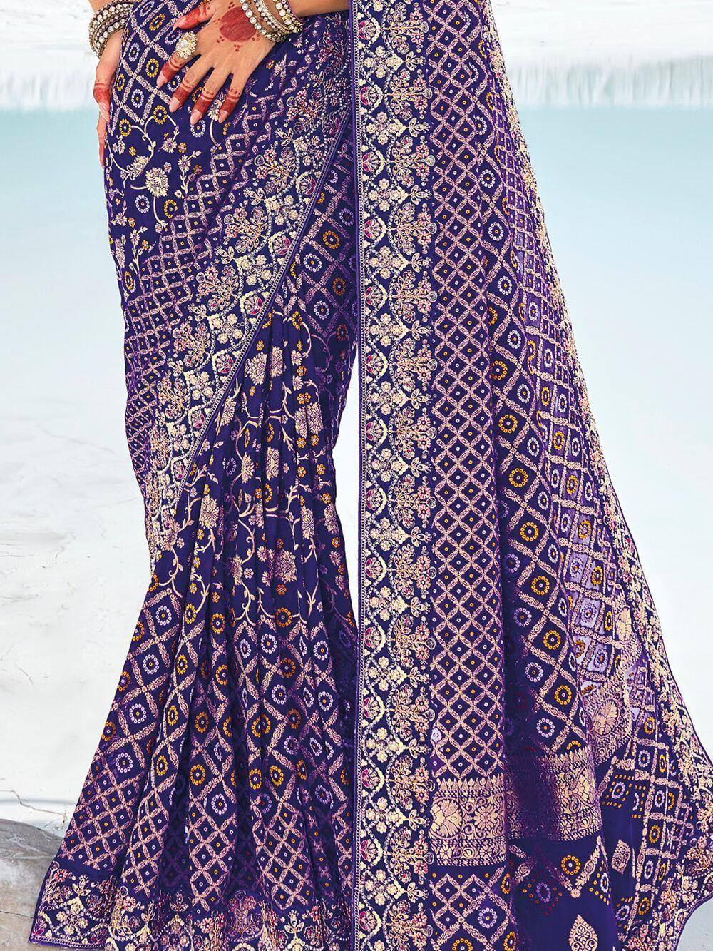 Purple floral and geometric print saree with gold detailing, perfect for Indian ethnic occasions