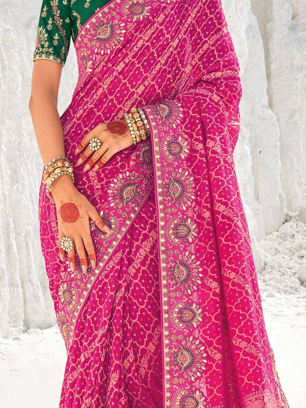 Pink embroidered saree with green blouse, henna hands, gold jewelry, Indian ethnic wear