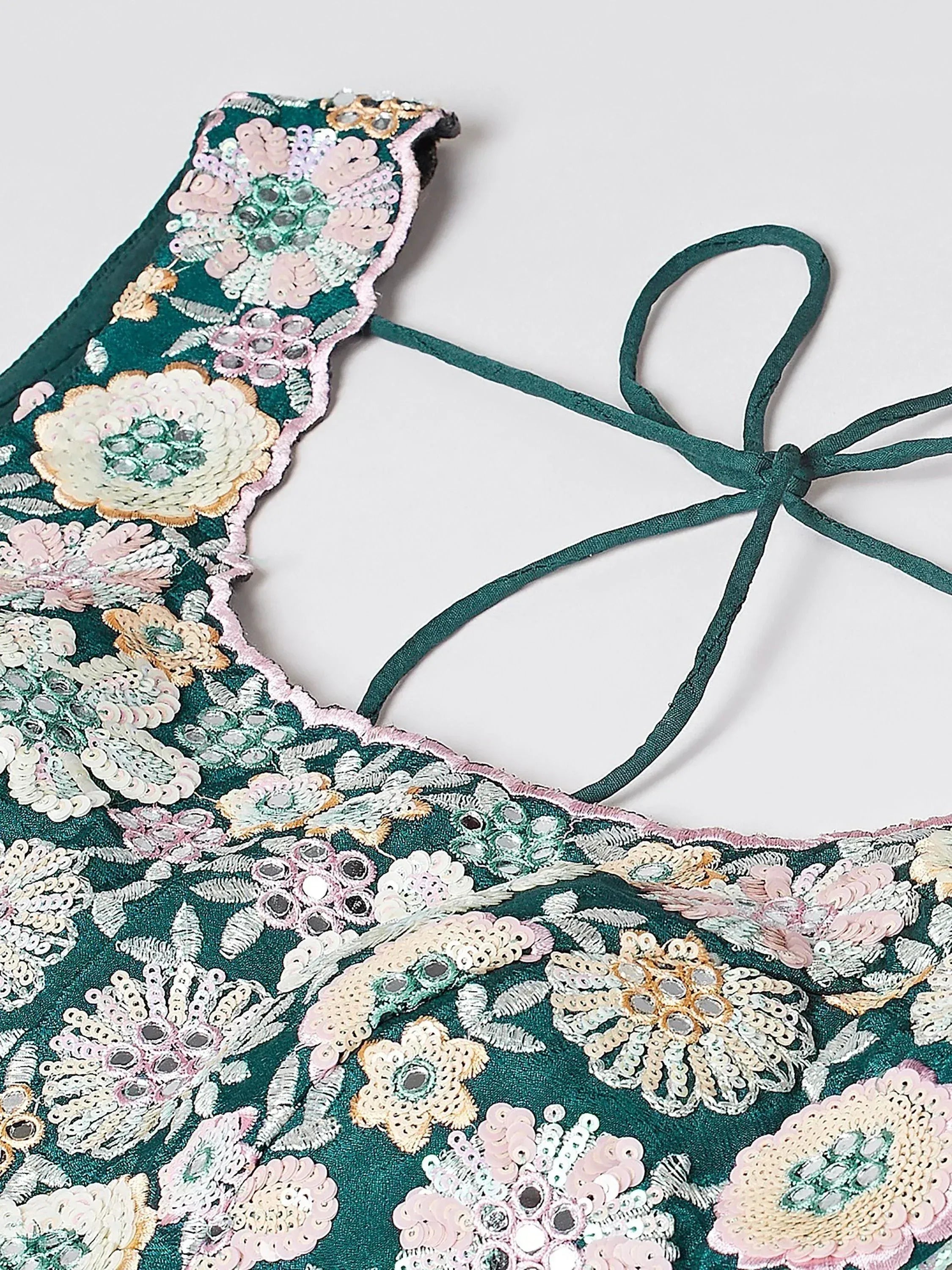 Emerald green ethnic top with floral sequin embroidery and tie-back detail