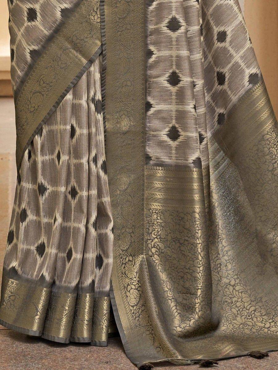 Elegant grey ikat saree with gold brocade border, perfect for Indian ethnic wear occasions