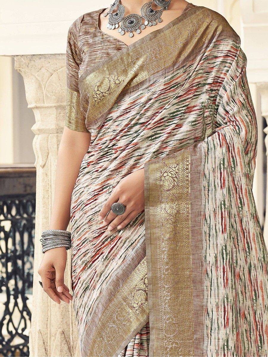 Elegant ethnic saree with gold border, multicolor stripes, and traditional jewelry for Indian wear