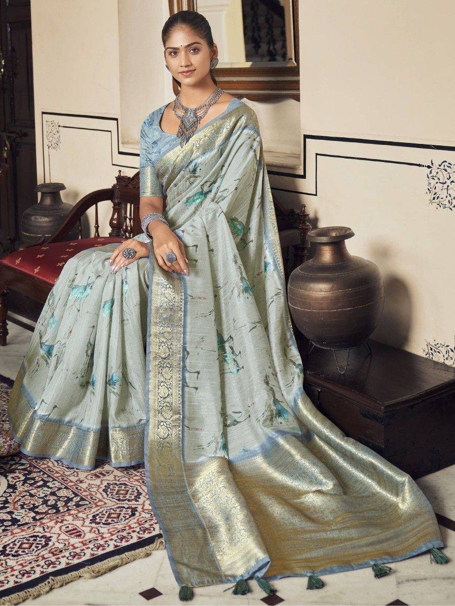 Elegant light blue printed saree with gold border, perfect for Indian ethnic wear occasions