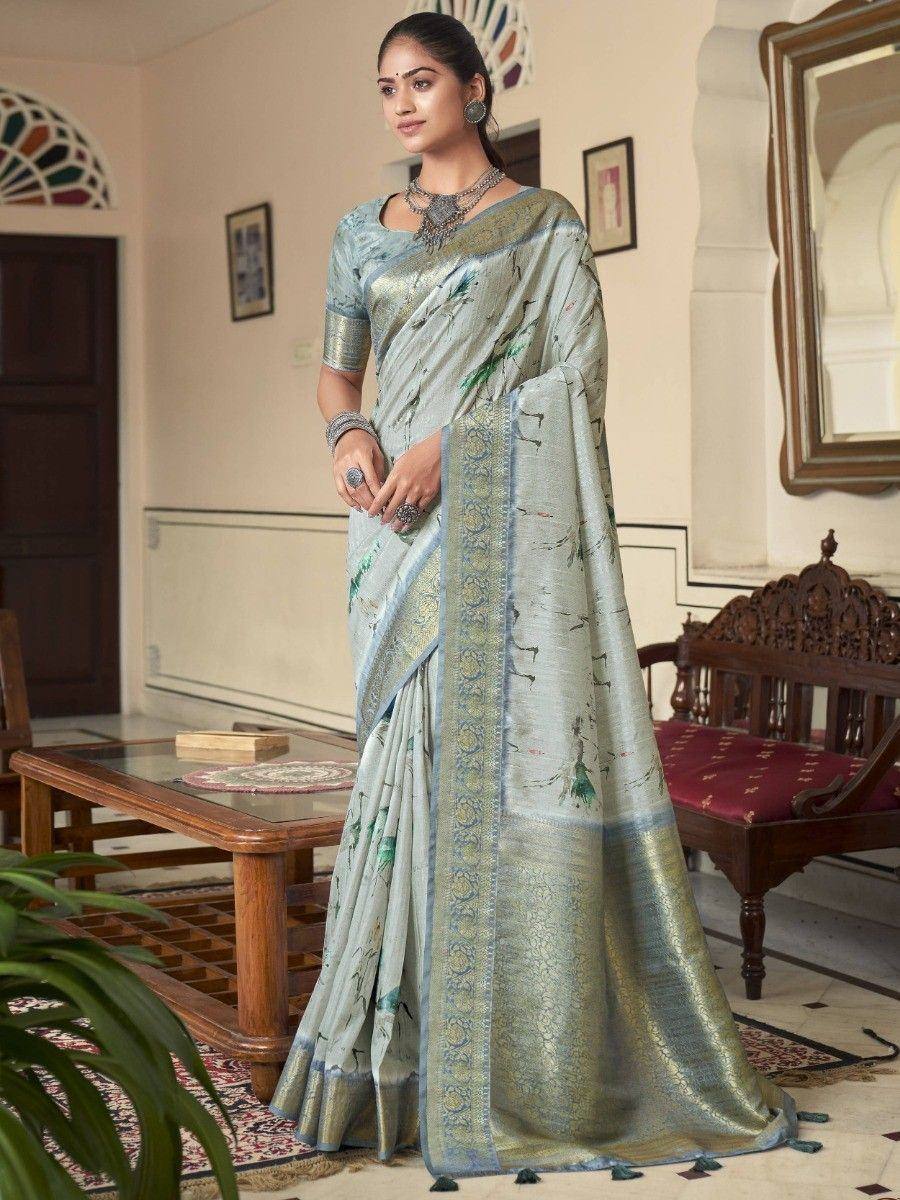 Elegant light blue printed saree with gold border, perfect for Indian ethnic occasions