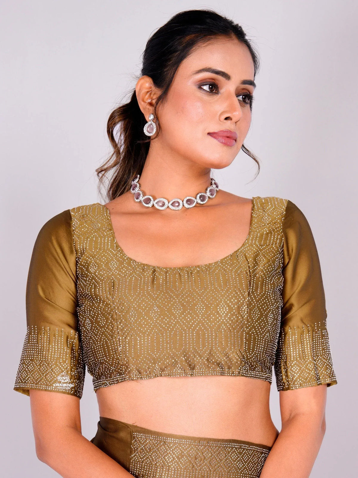Olive green embroidered blouse with sequins, paired with matching skirt, perfect for Indian ethnic wear