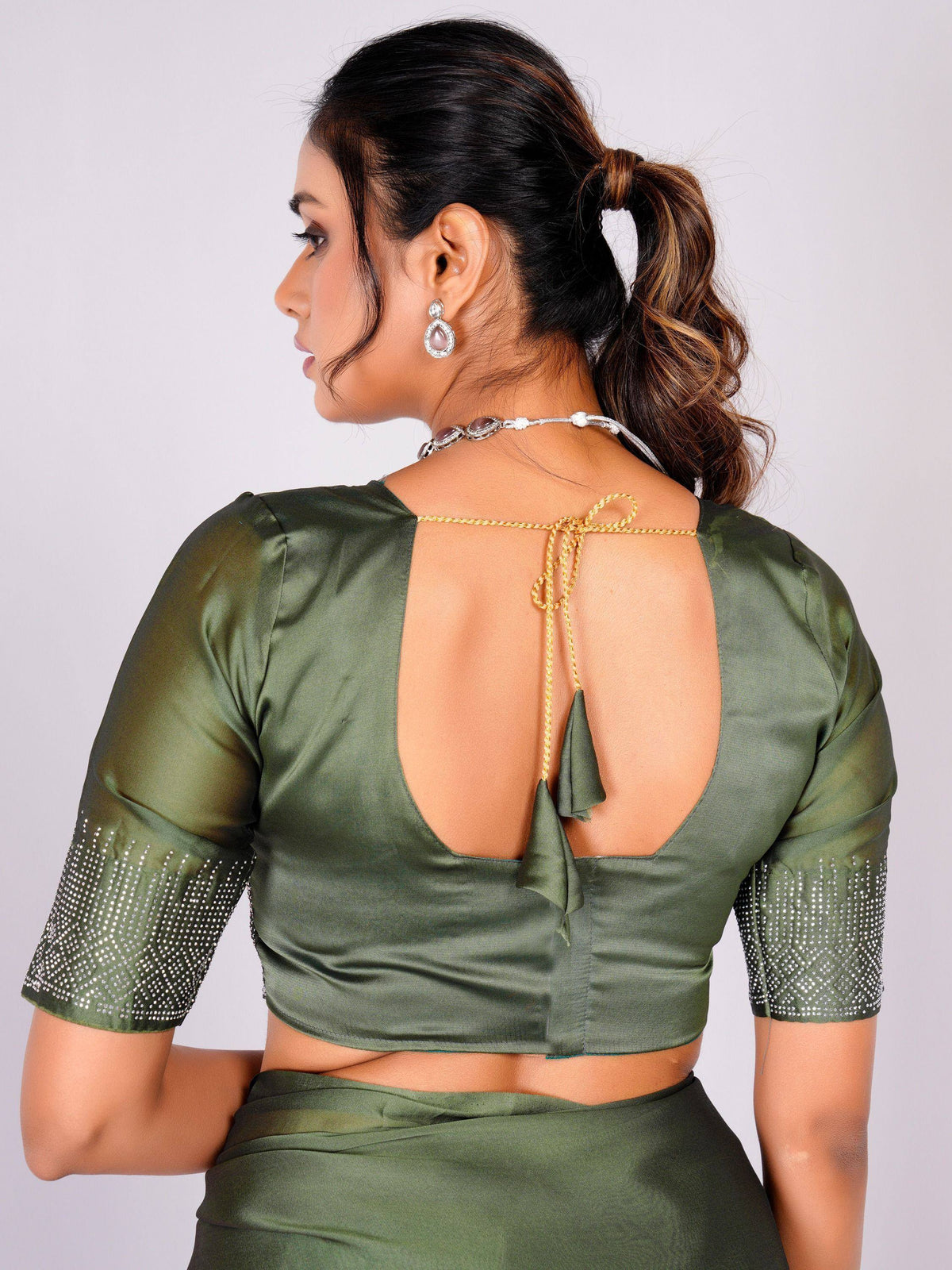 Olive green satin saree blouse with back tie, studded sleeves, and open back design