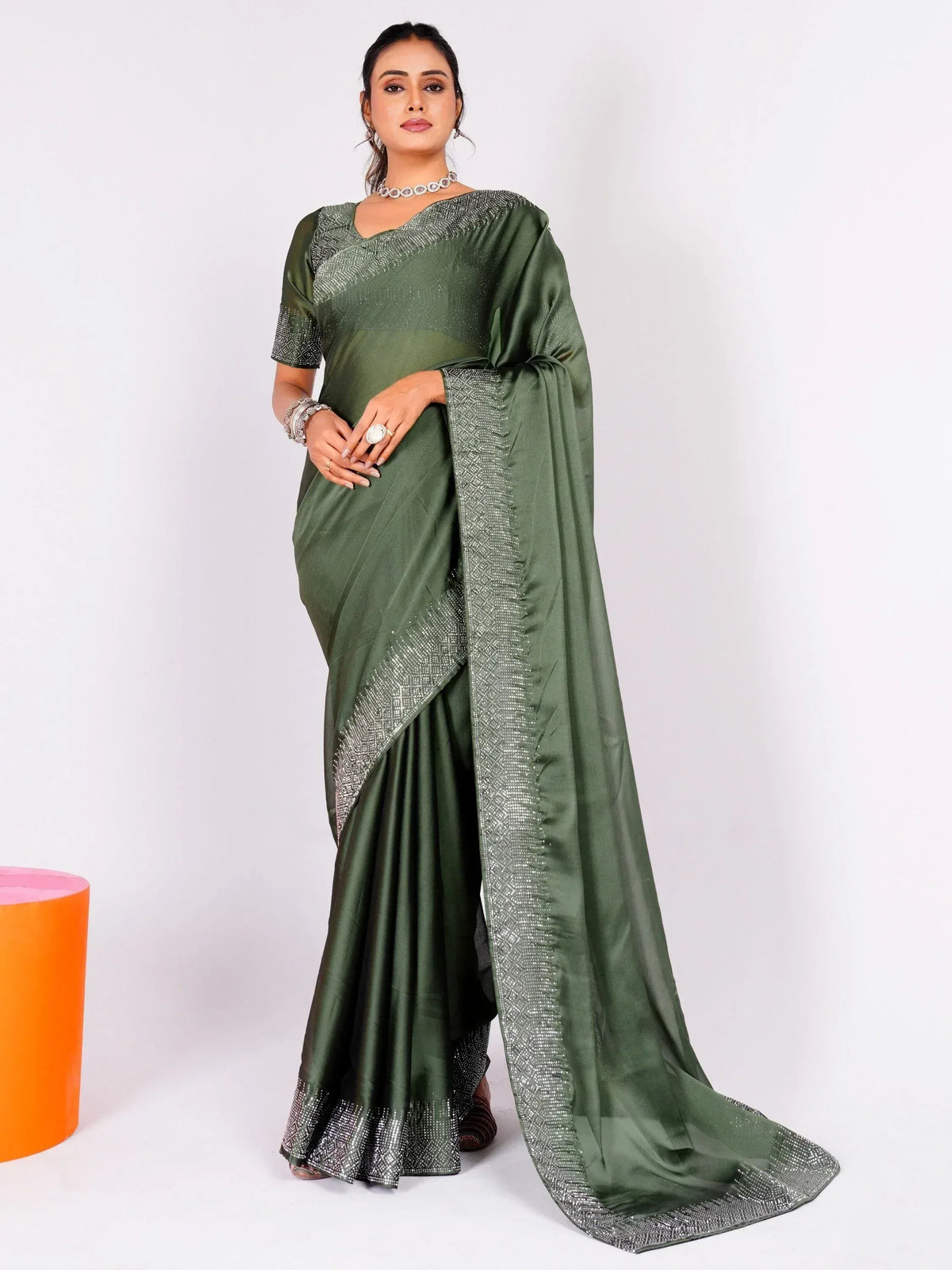 Olive green saree with silver embellishments, perfect for Indian ethnic wear and festive occasions.