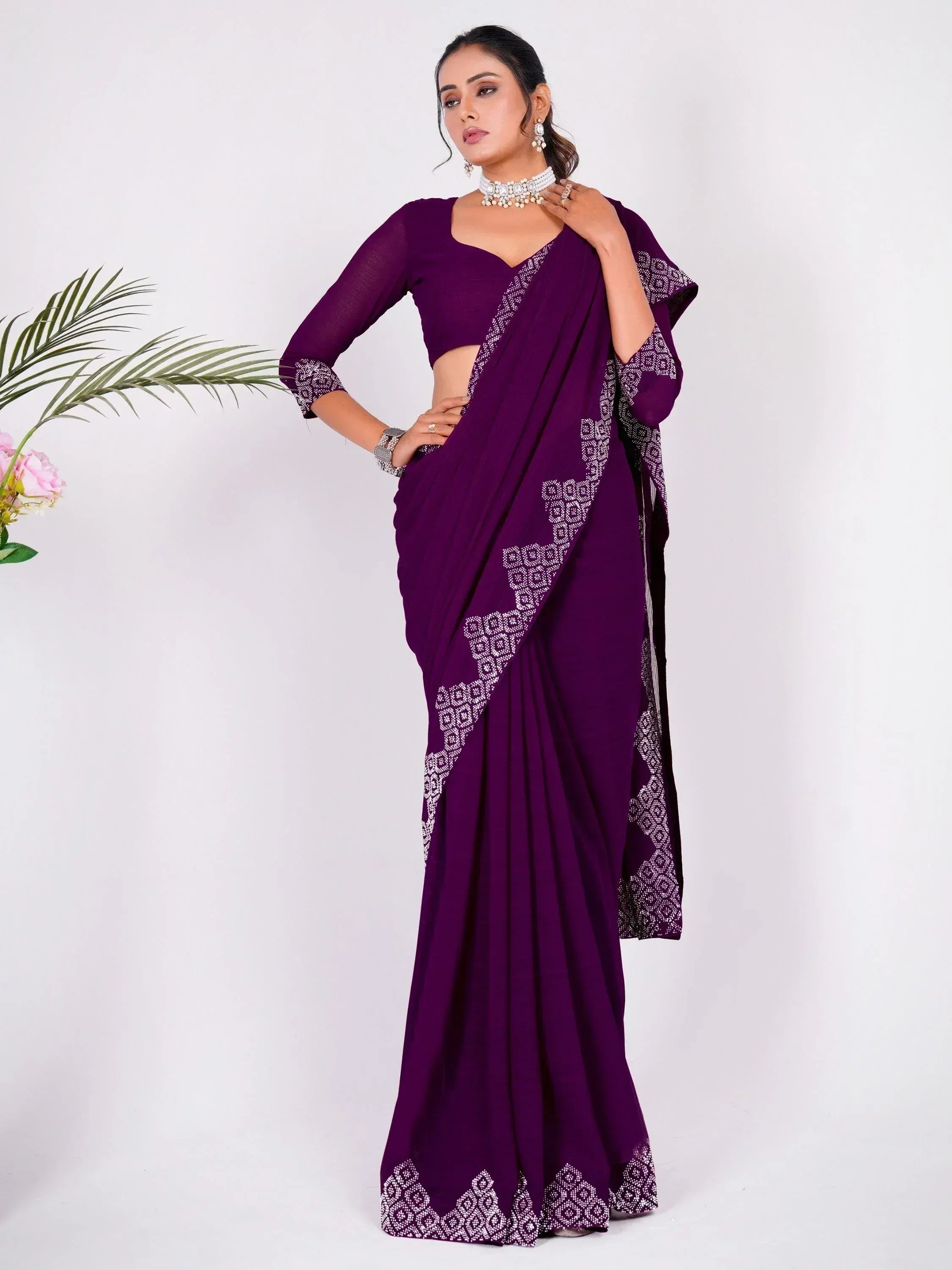 Purple designer saree with white geometric embroidery, paired with matching blouse for ethnic wear
