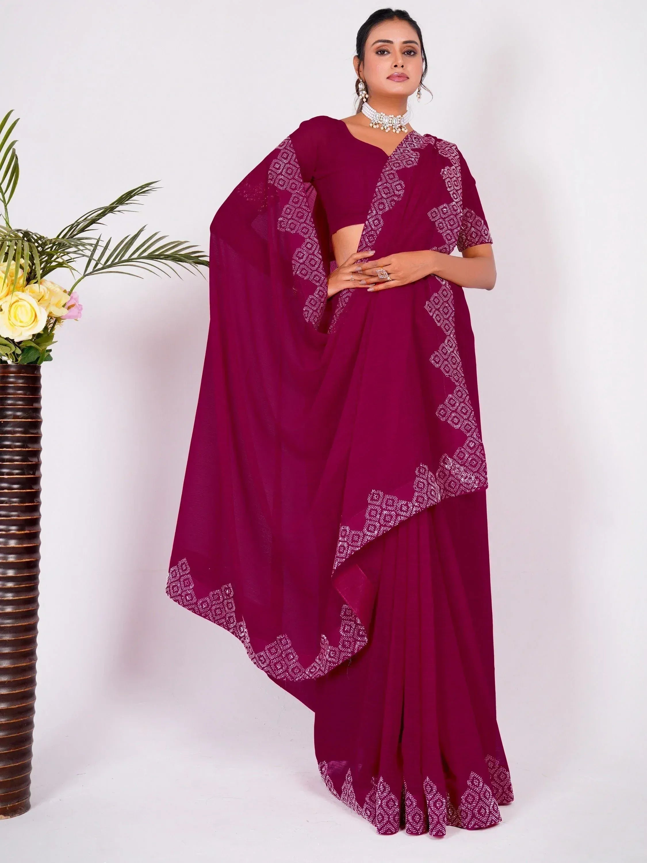 Elegant maroon saree with white embroidery, perfect for Indian ethnic occasions and festive wear.