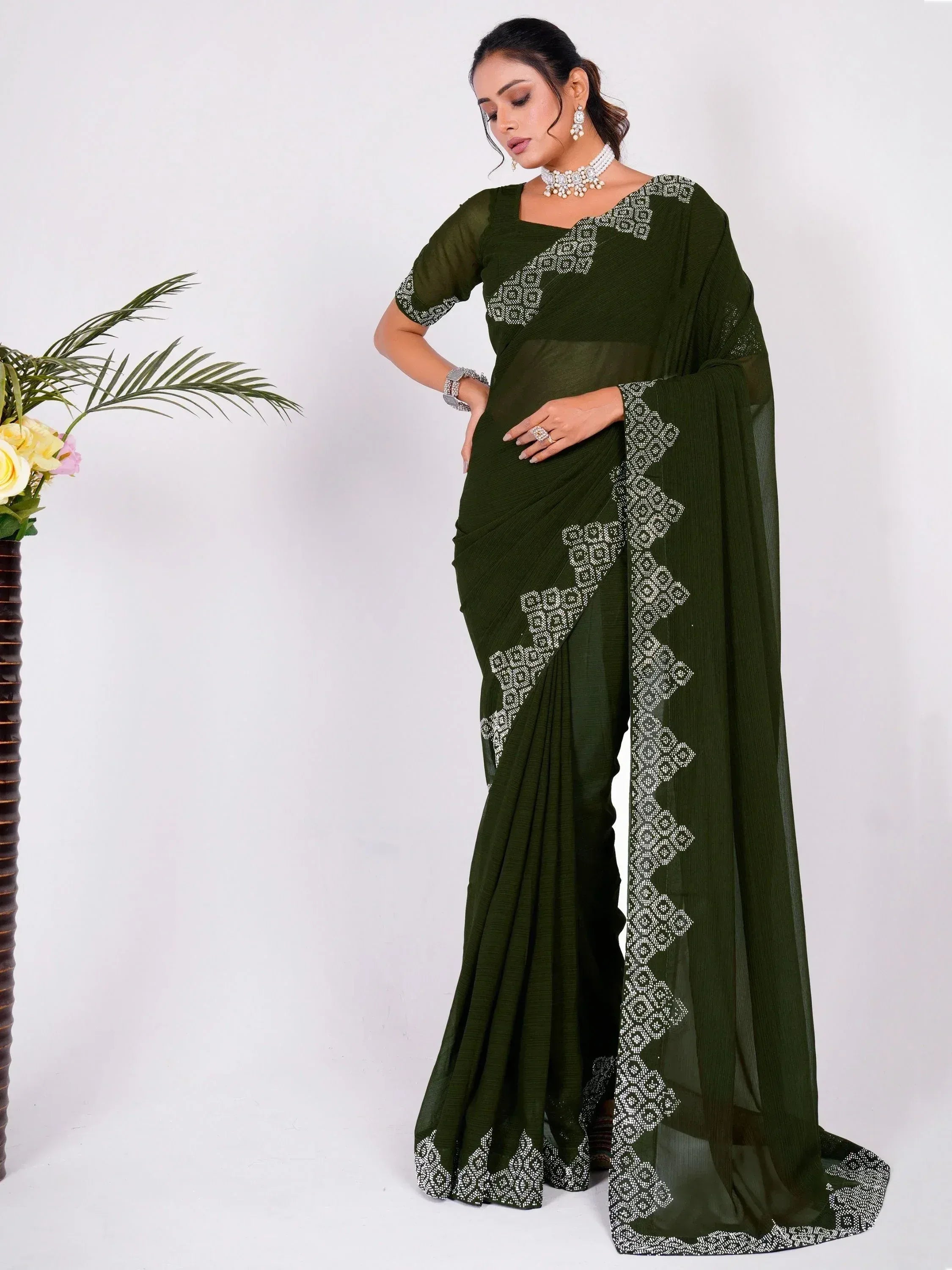 Olive green saree with white geometric embroidery, perfect for ethnic wear occasions