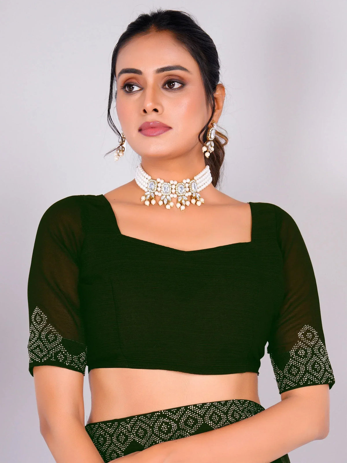 Green embroidered blouse with sheer sleeves, paired with pearl and stone choker necklace for ethnic wear