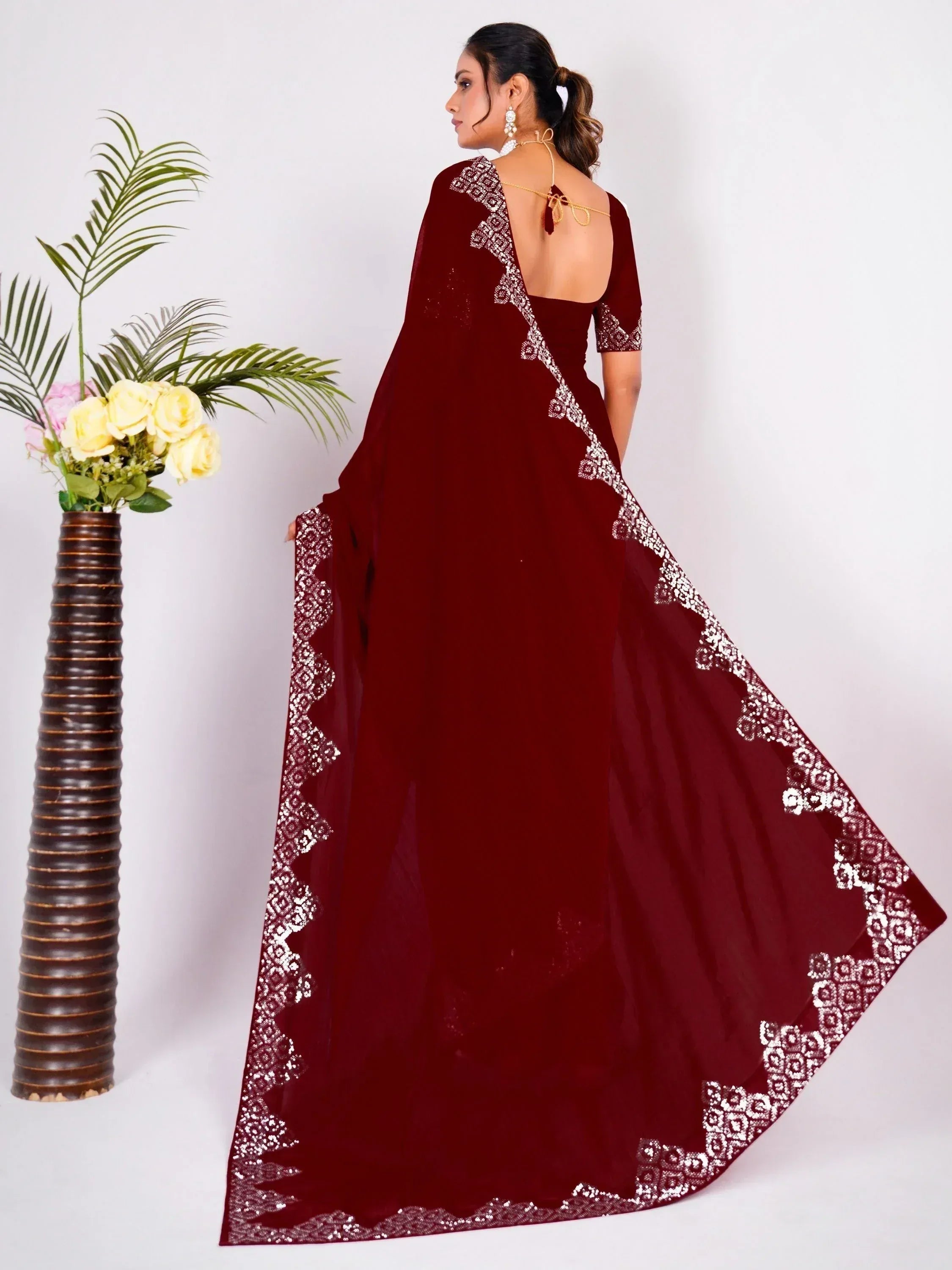 Maroon designer saree with silver embroidery, backless blouse, perfect for ethnic occasions