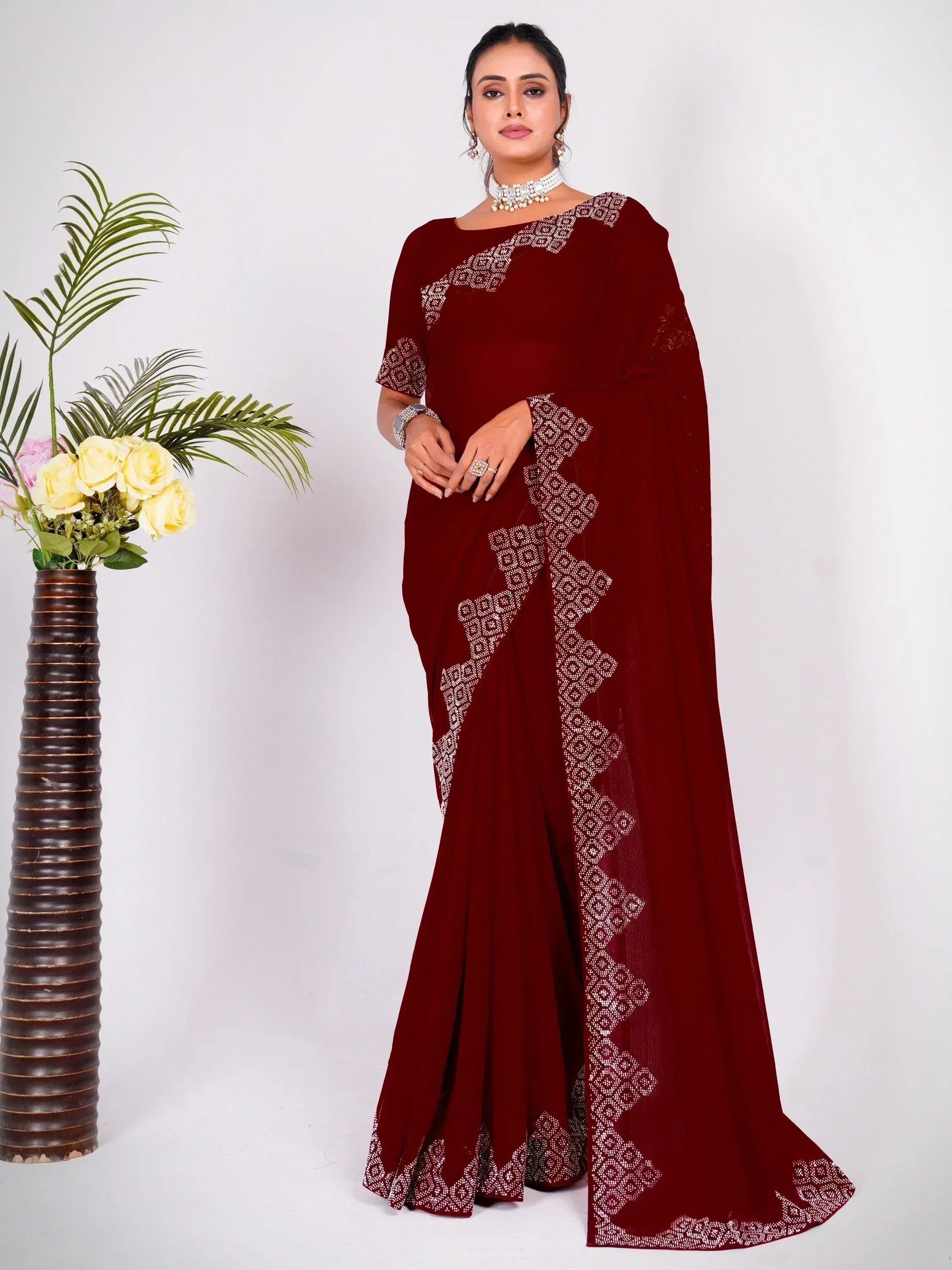 Maroon designer saree with white geometric embroidery, perfect for Indian ethnic wear occasions