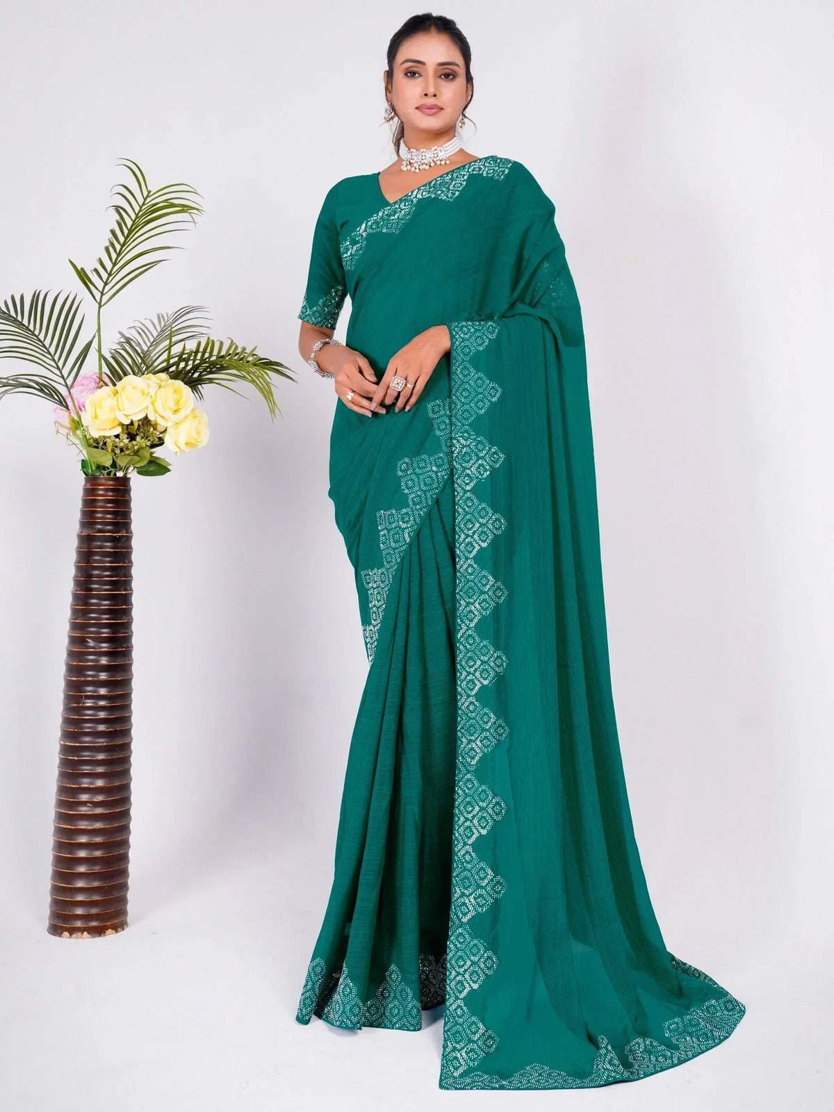 Emerald green saree with white geometric print, perfect for Indian ethnic wear occasions.