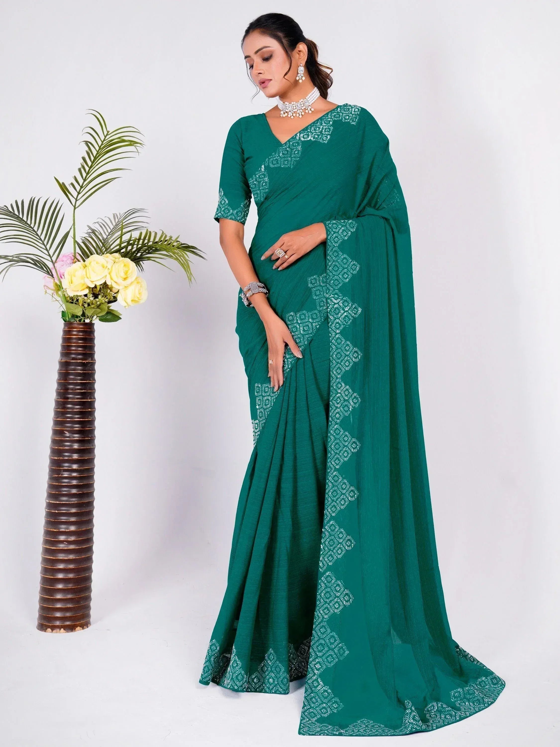 Emerald green saree with white geometric print, perfect for Indian ethnic wear occasions.
