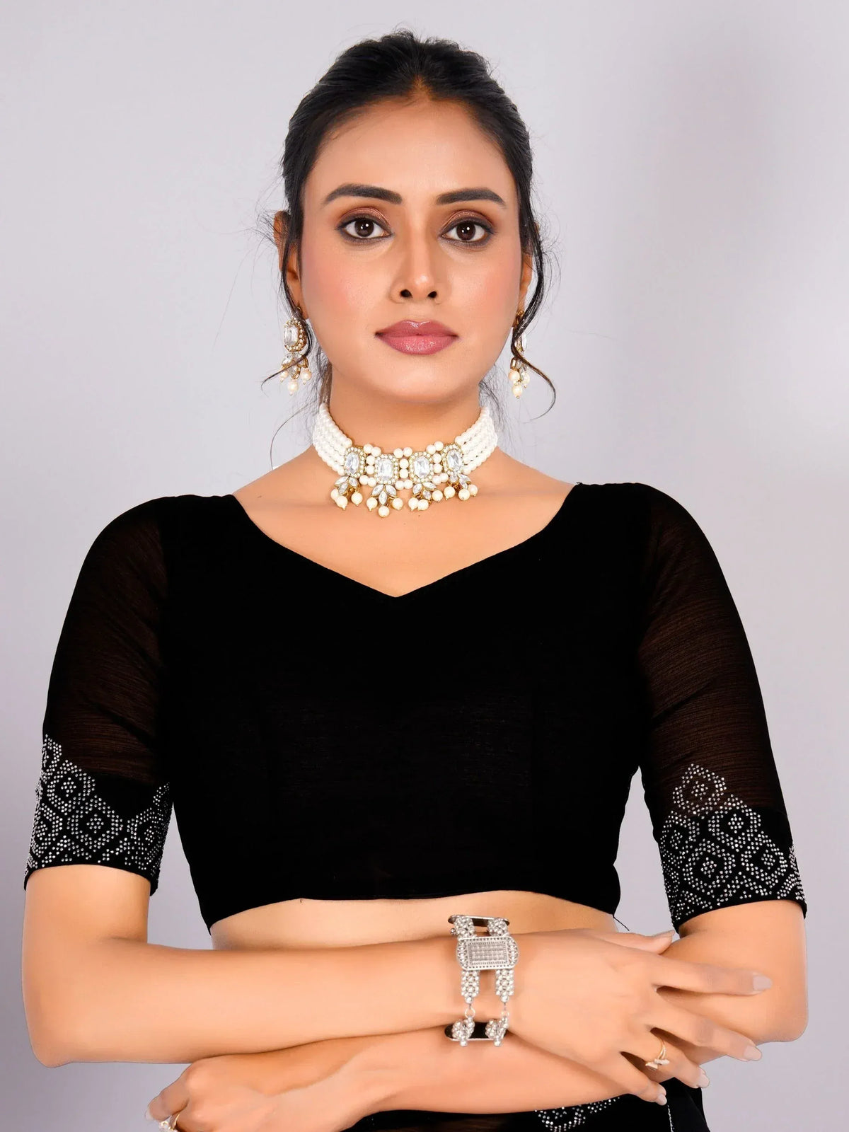 Black velvet ethnic blouse with pearl and stone choker necklace, matching earrings, and bracelet