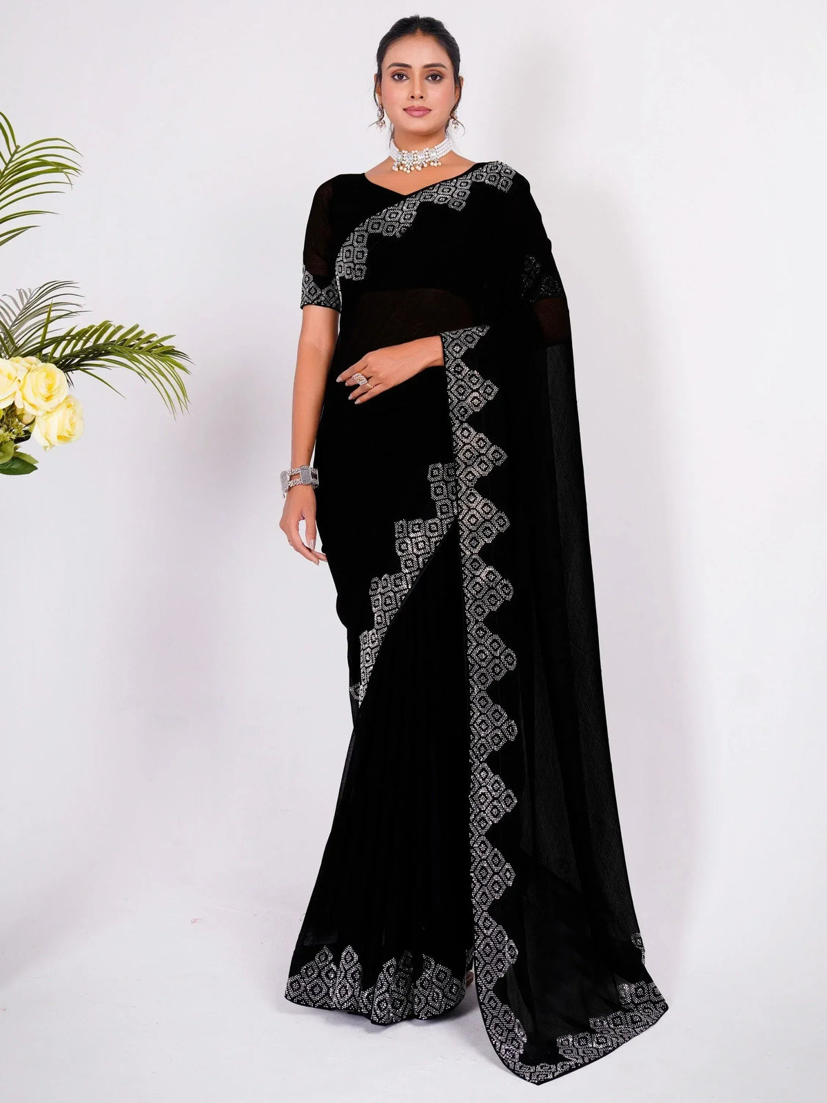 Black velvet saree with white geometric embroidery, perfect for Indian ethnic wear occasions