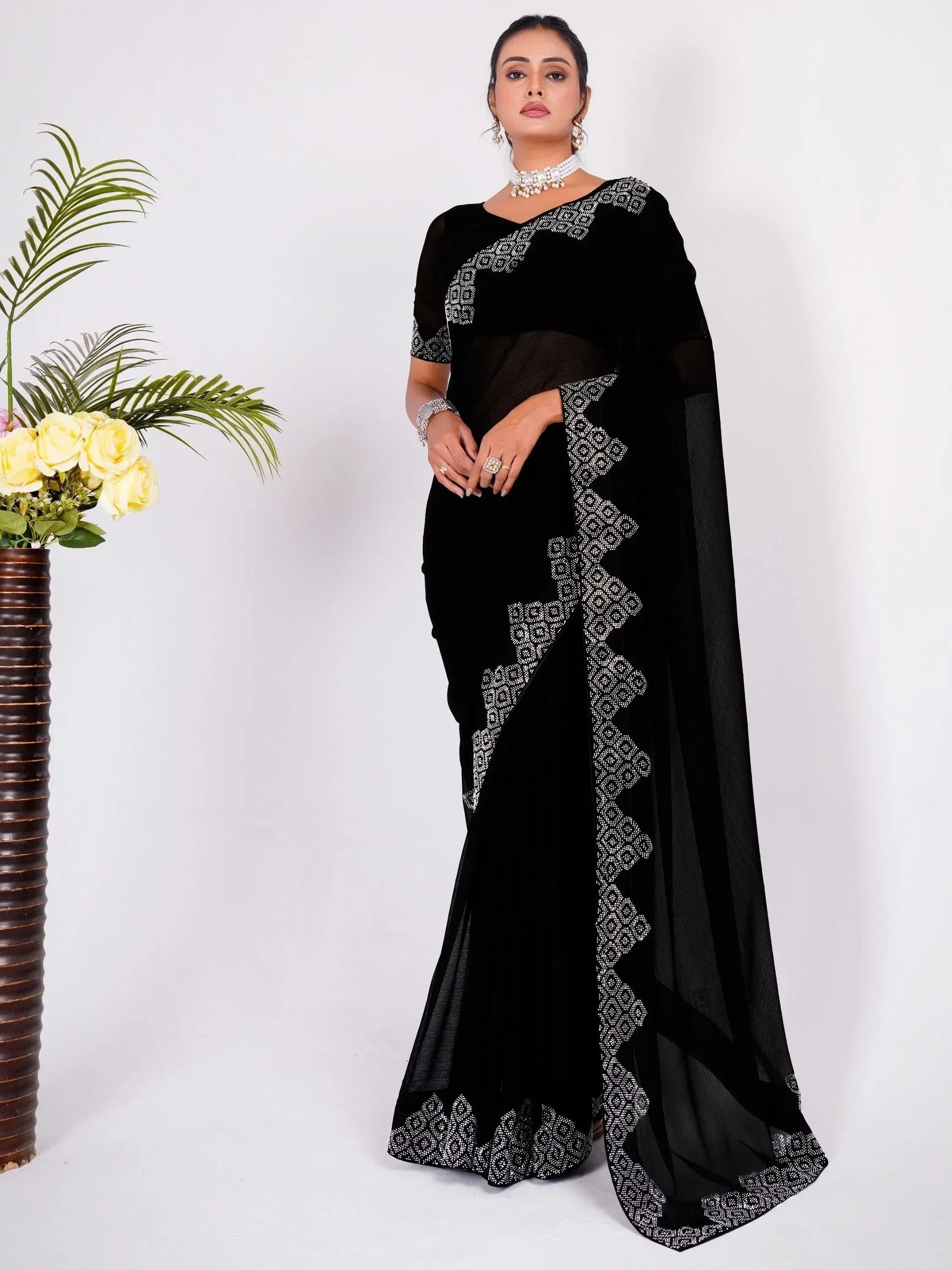 Black velvet saree with white geometric embroidery, elegant Indian ethnic wear for women