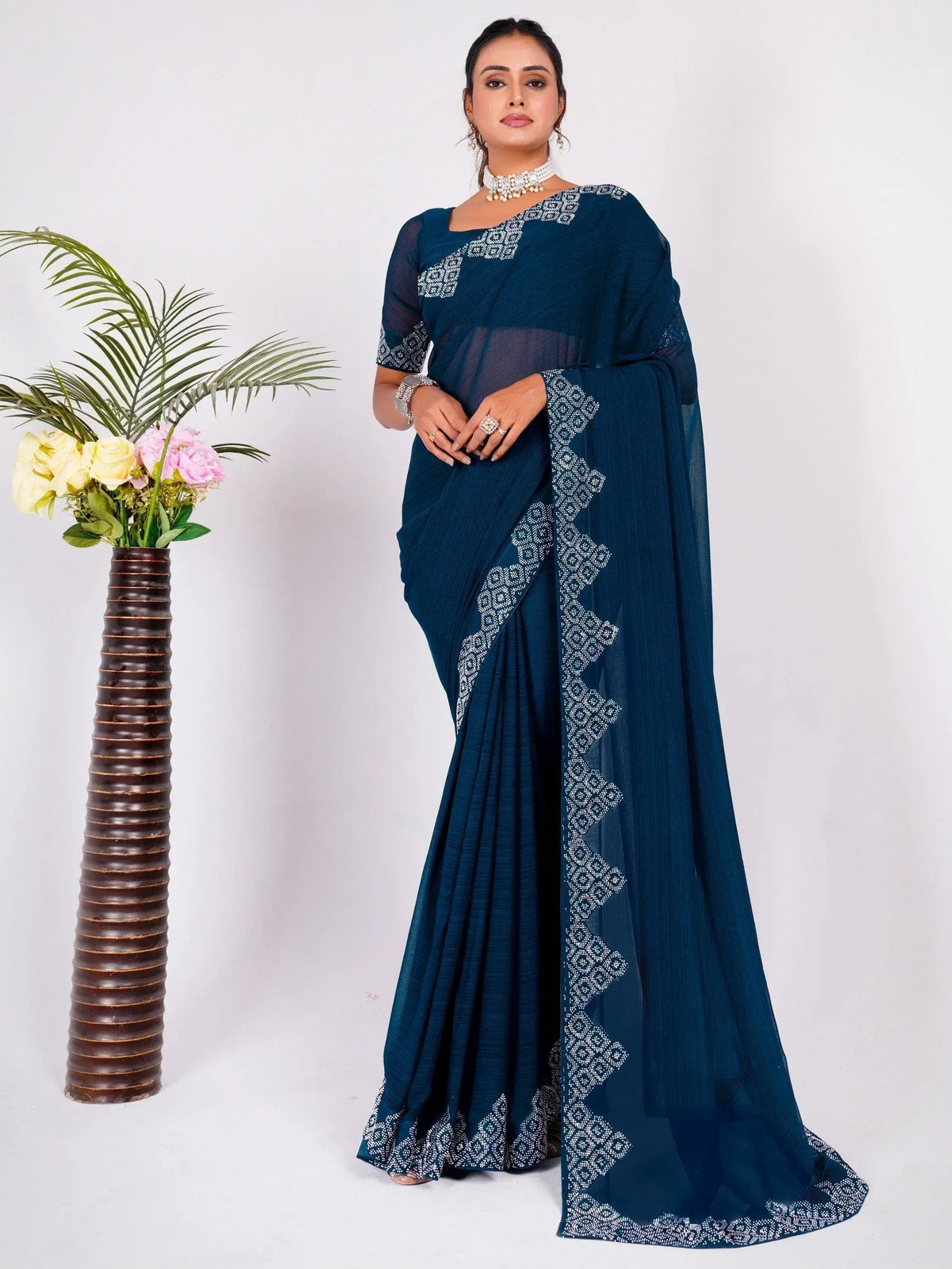 Elegant navy blue saree with white geometric embroidery, perfect for Indian ethnic wear occasions.