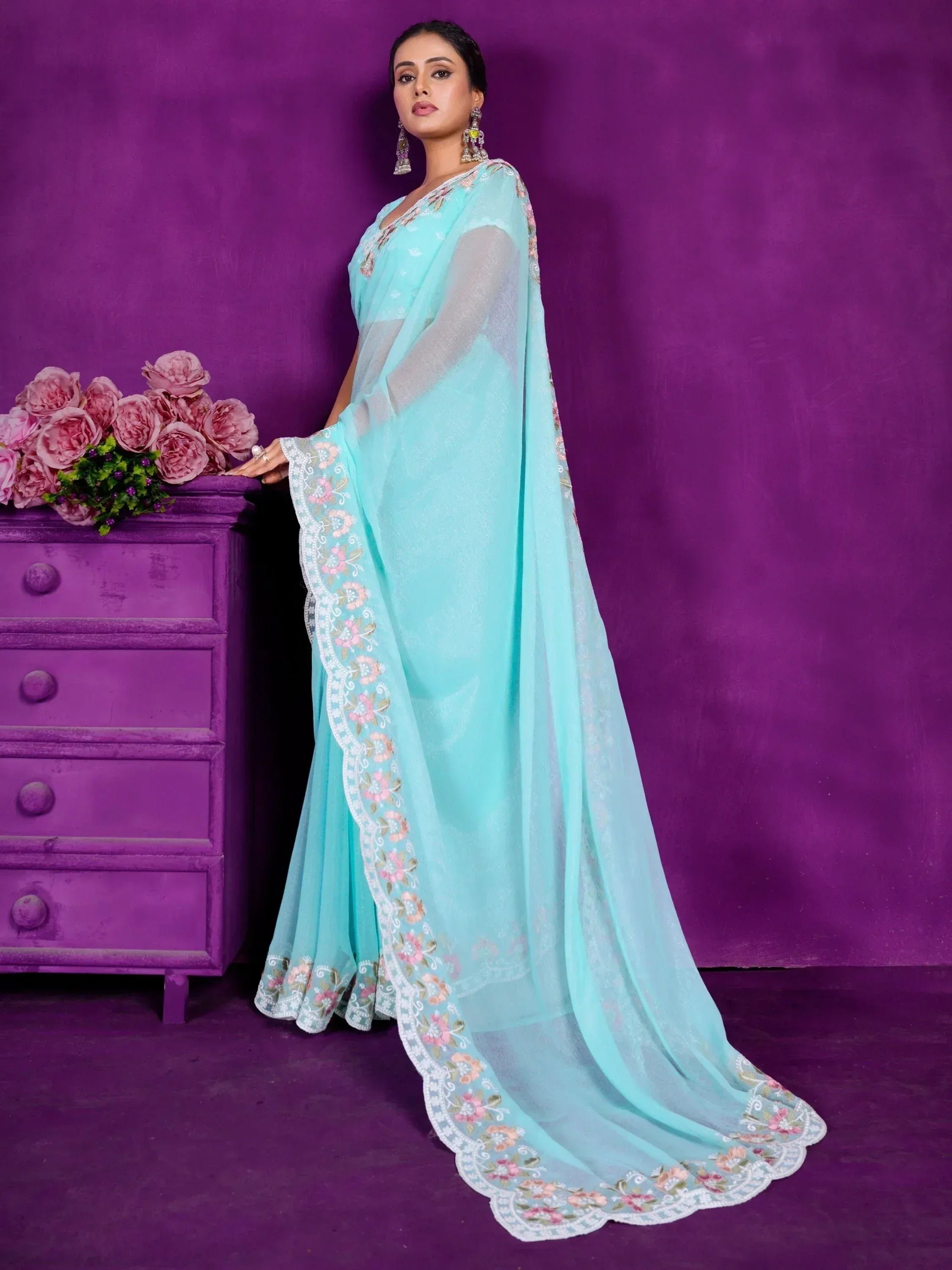 Mint green embroidered saree with floral border, perfect for Indian ethnic wear occasions