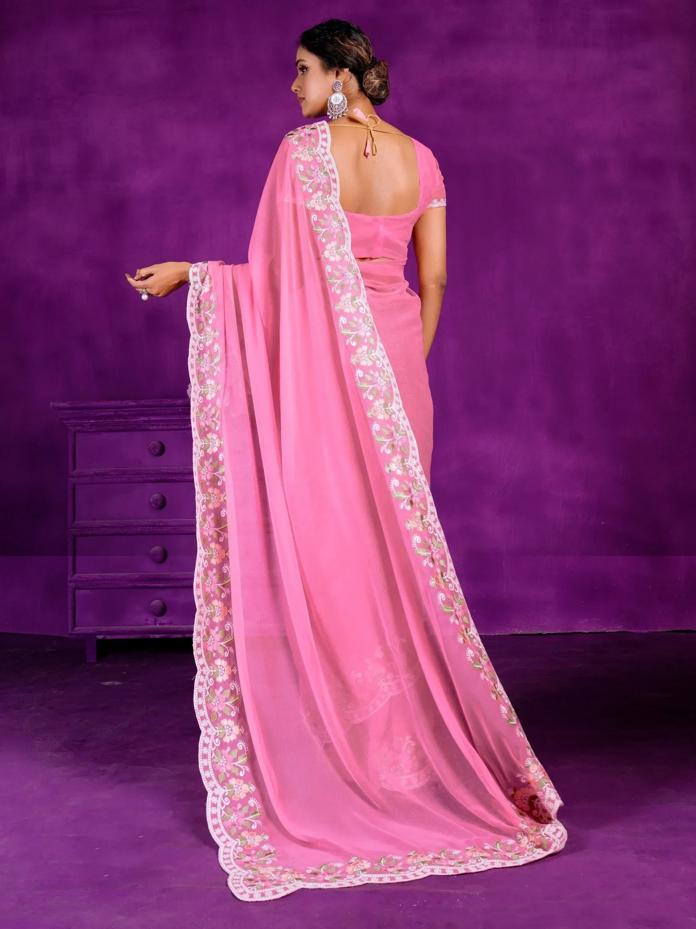 Pink embroidered saree with floral border, back view, ethnic Indian wear