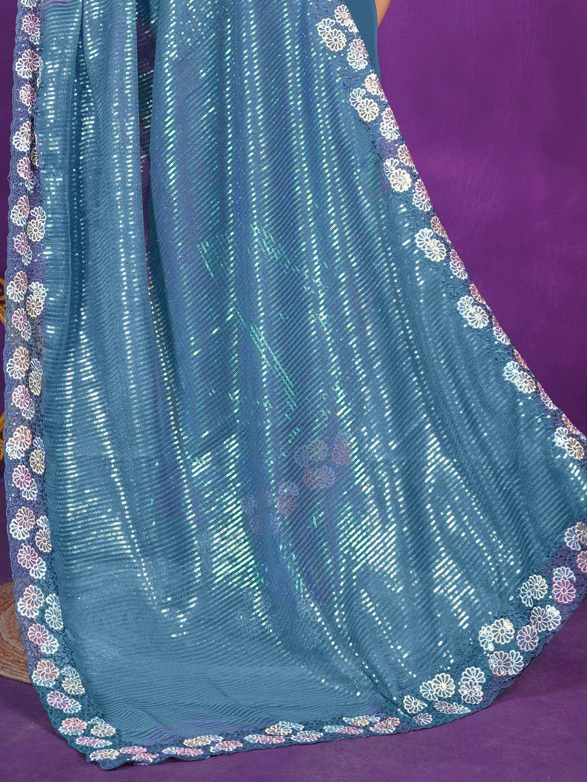 Teal sequin ethnic gown with floral lace border, perfect for Indian festive wear