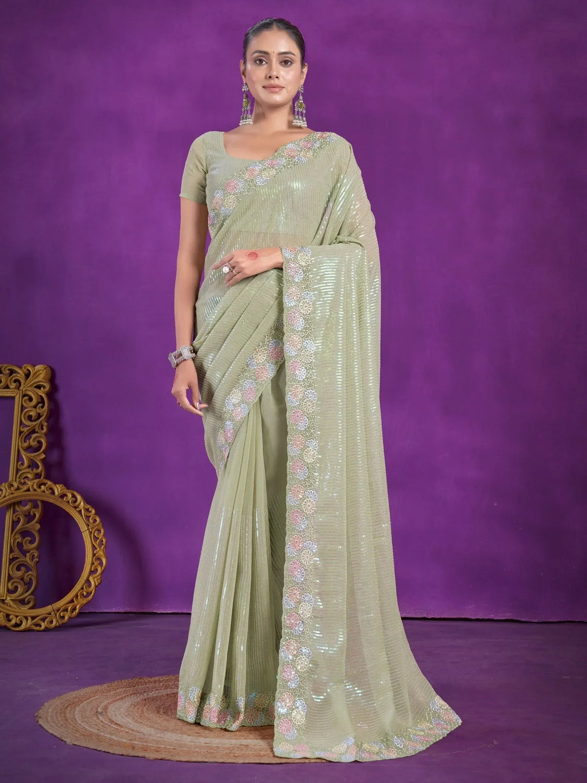 Elegant light green sequin saree with floral embroidery, perfect for Indian ethnic occasions.
