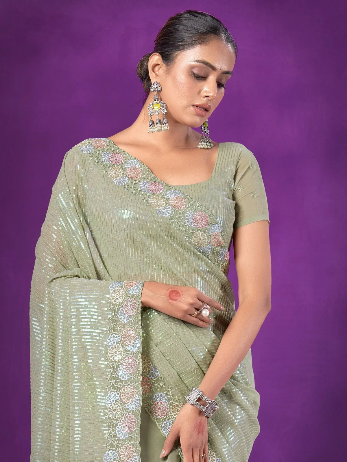 Olive green sequin saree with floral embroidery, perfect for Indian ethnic wear occasions.