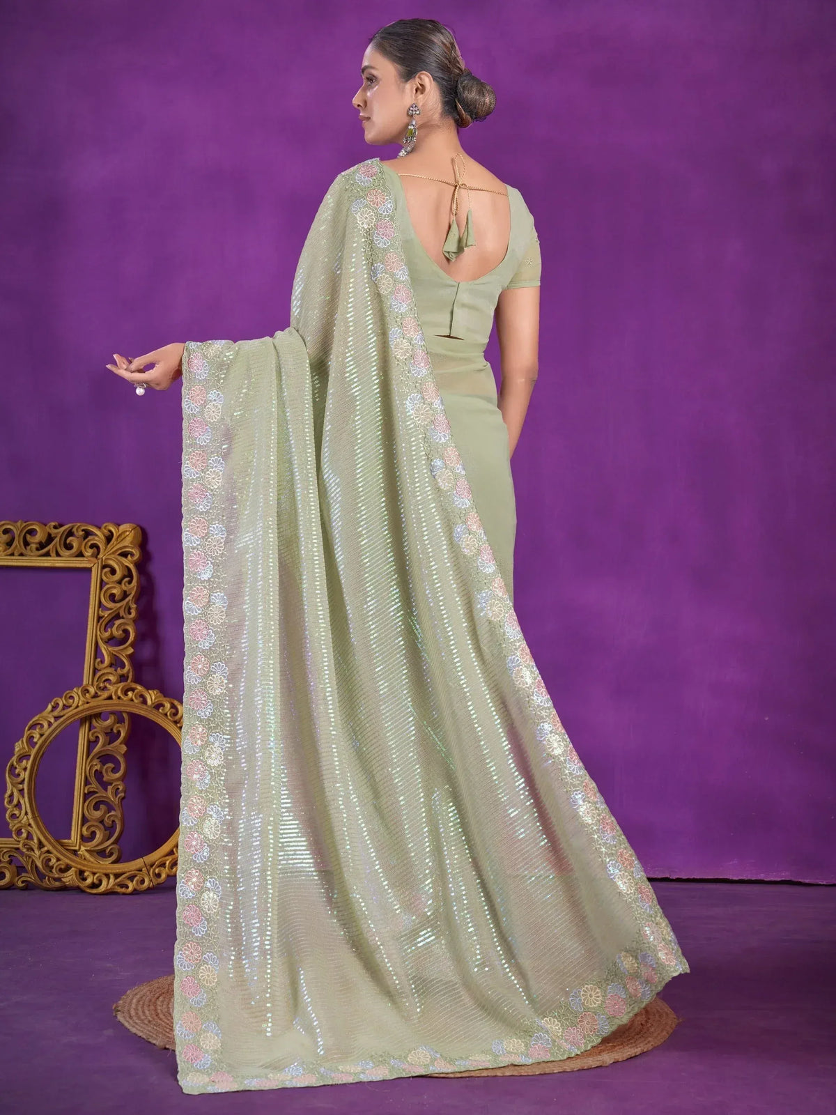 Olive green designer saree with floral embroidery and sequin work, back view