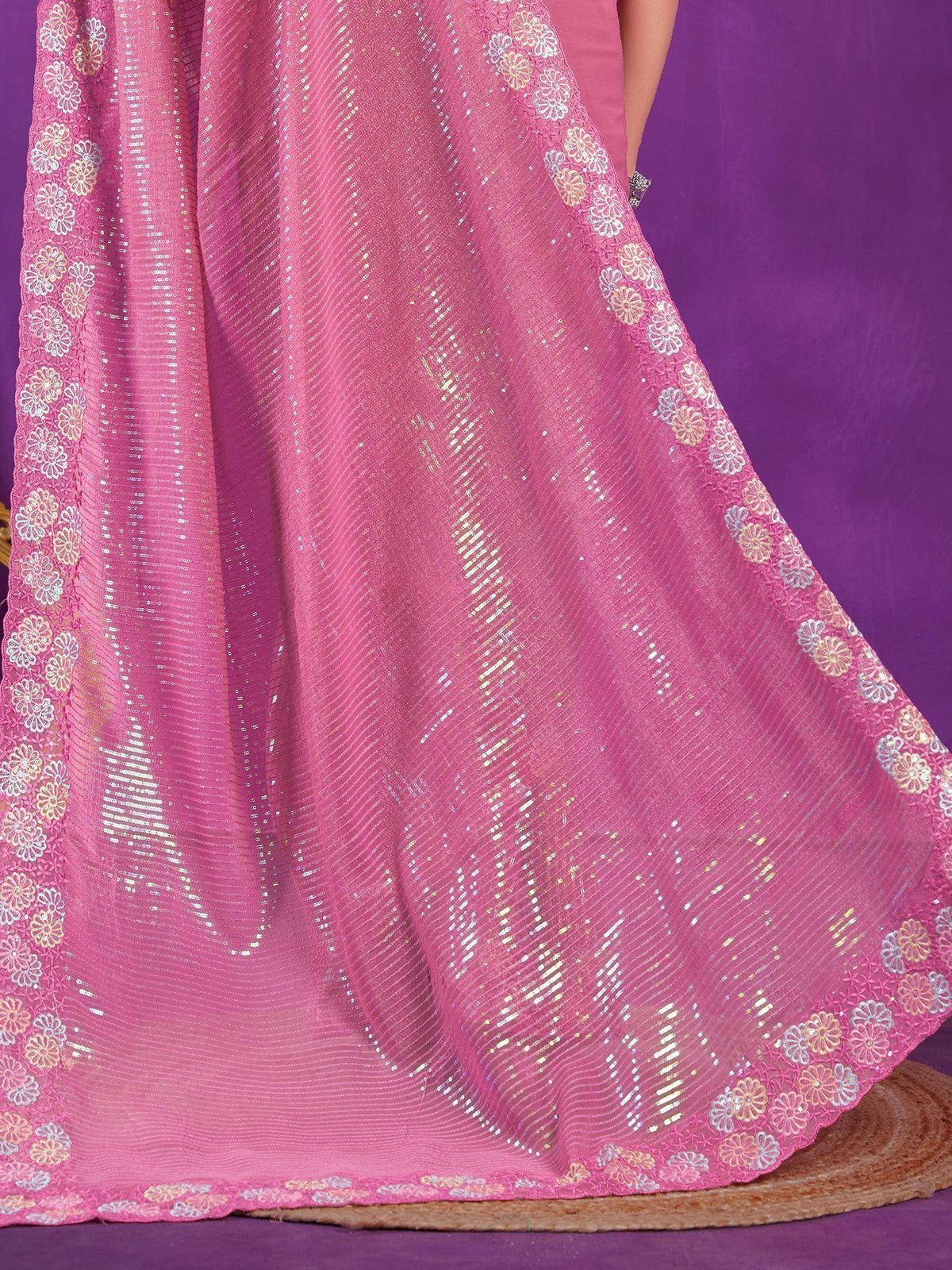 Pink sequined ethnic gown with floral lace border, perfect for festive occasions and Indian celebrations