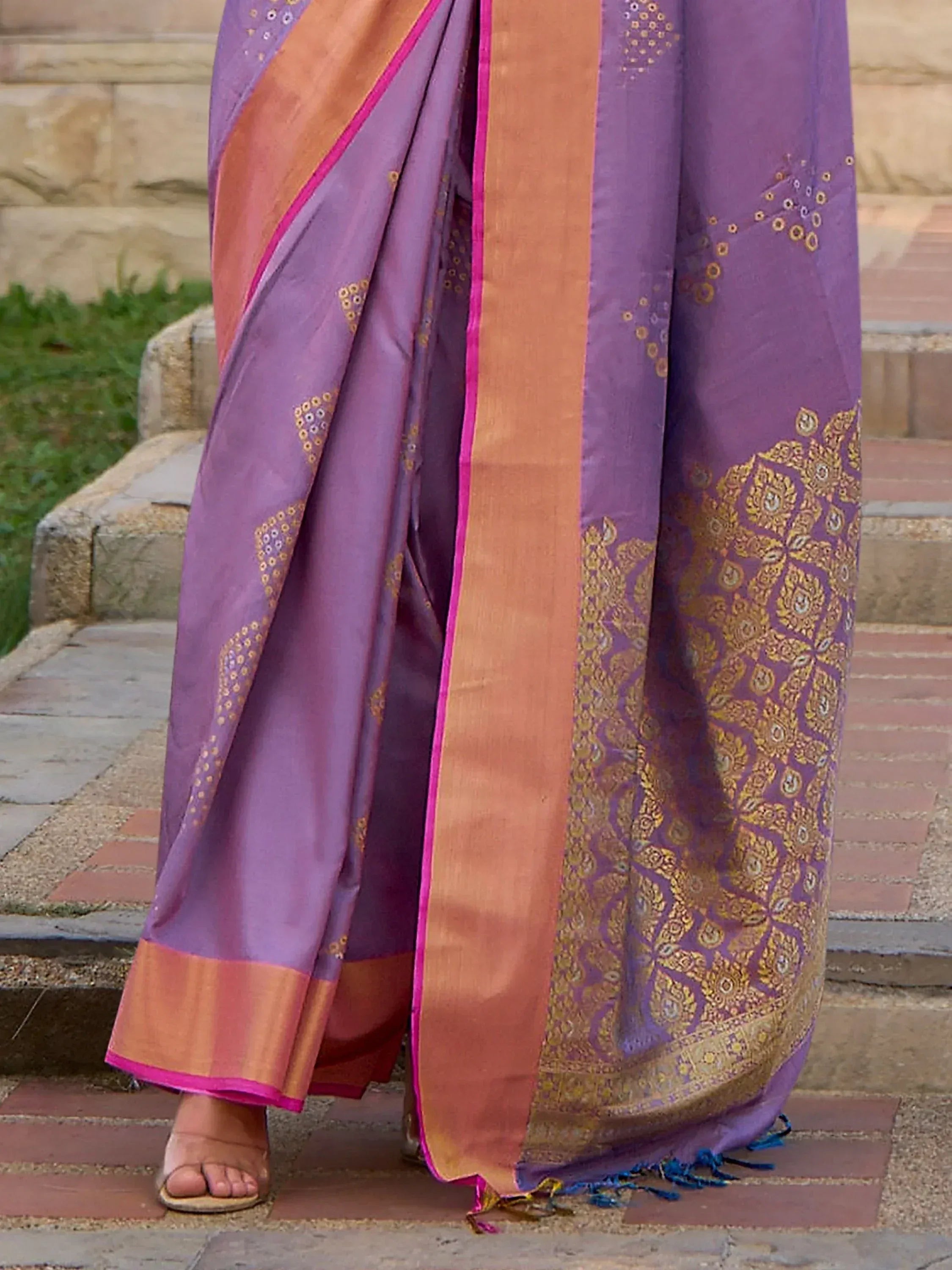 Purple and gold designer saree with intricate embroidery and contrast border, perfect for ethnic occasions