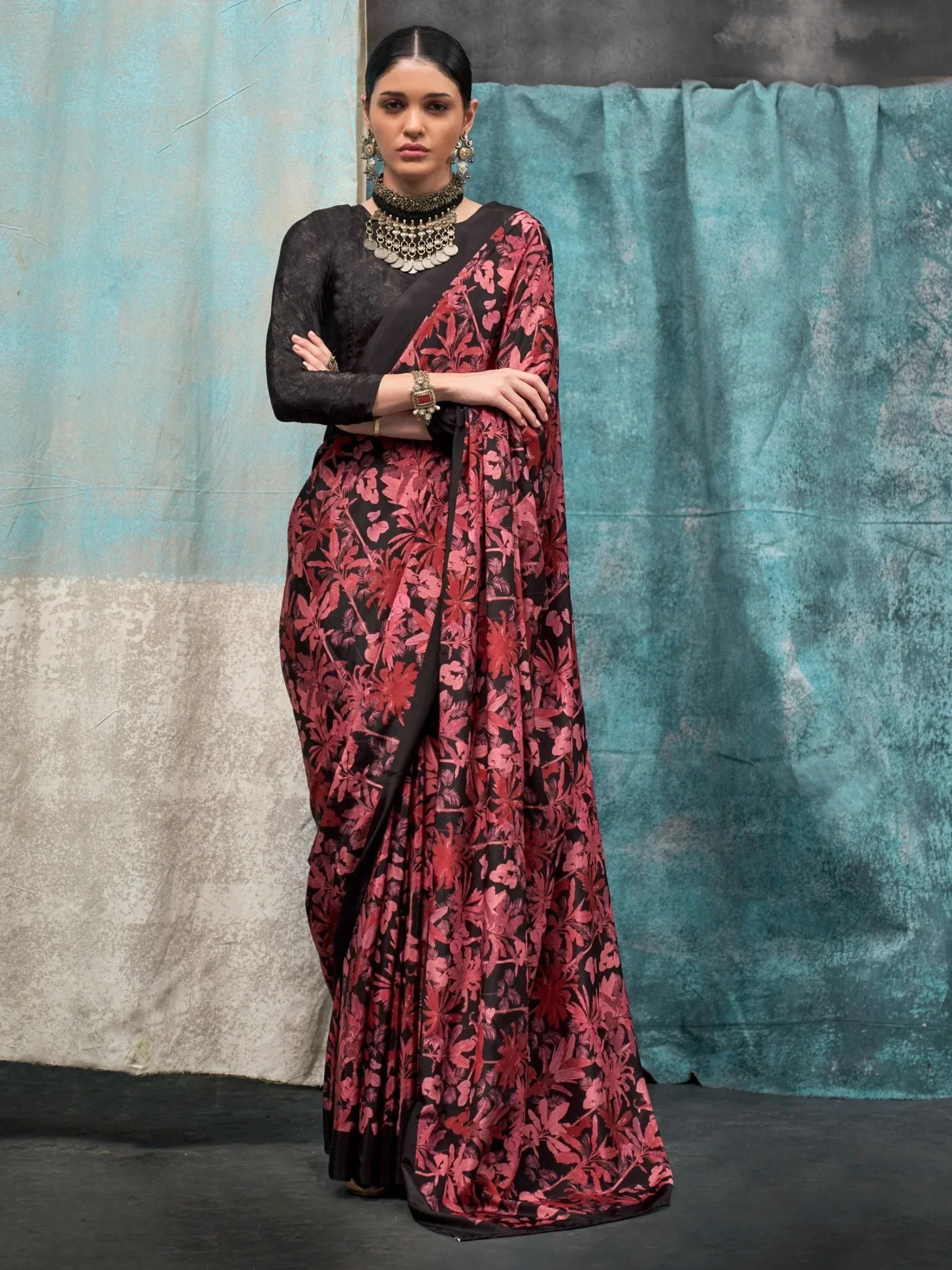 Black and red floral print saree with matching blouse, styled with traditional jewelry for ethnic wear