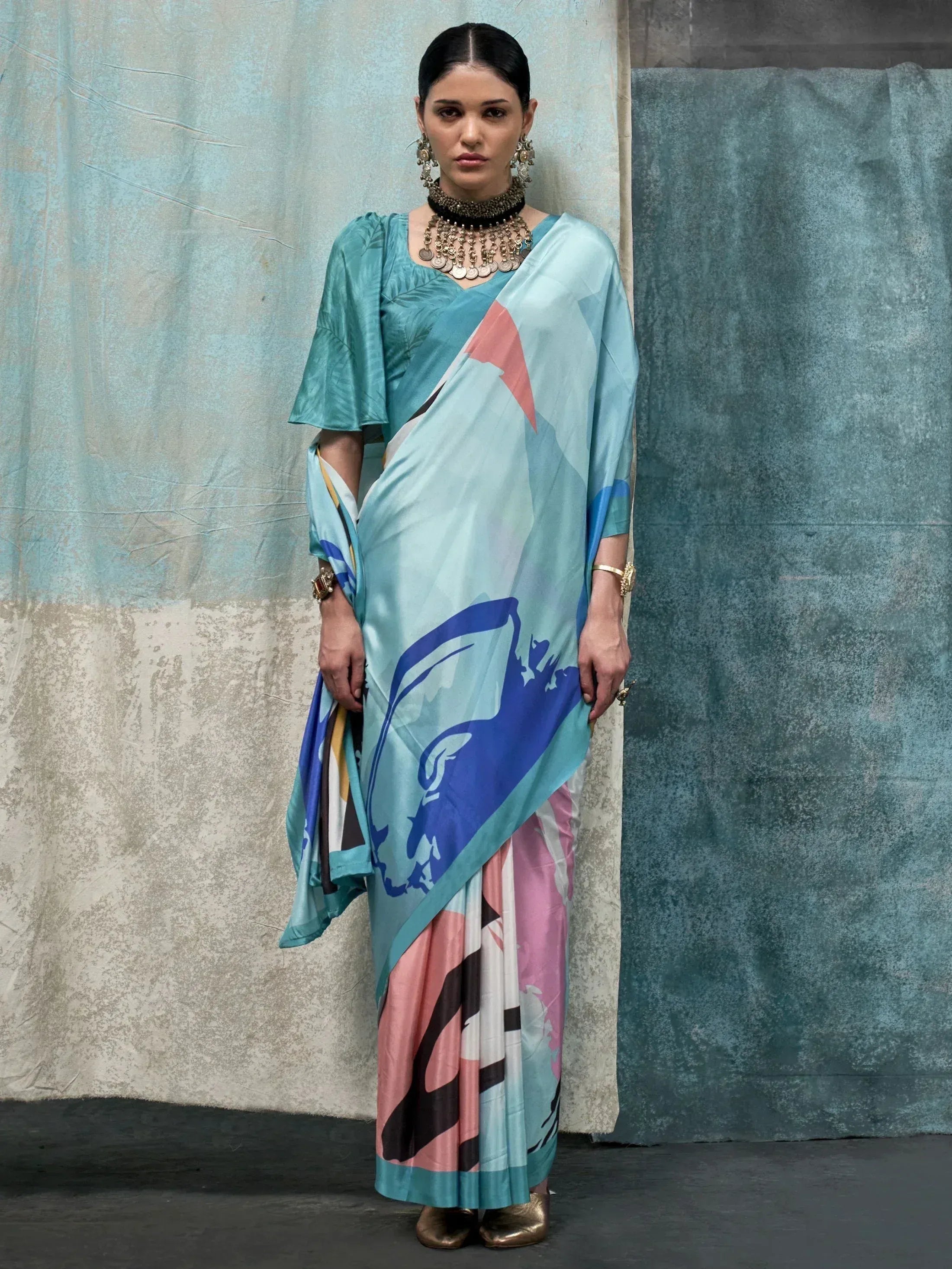 Woman in stylish printed saree with geometric design, ethnic wear for women