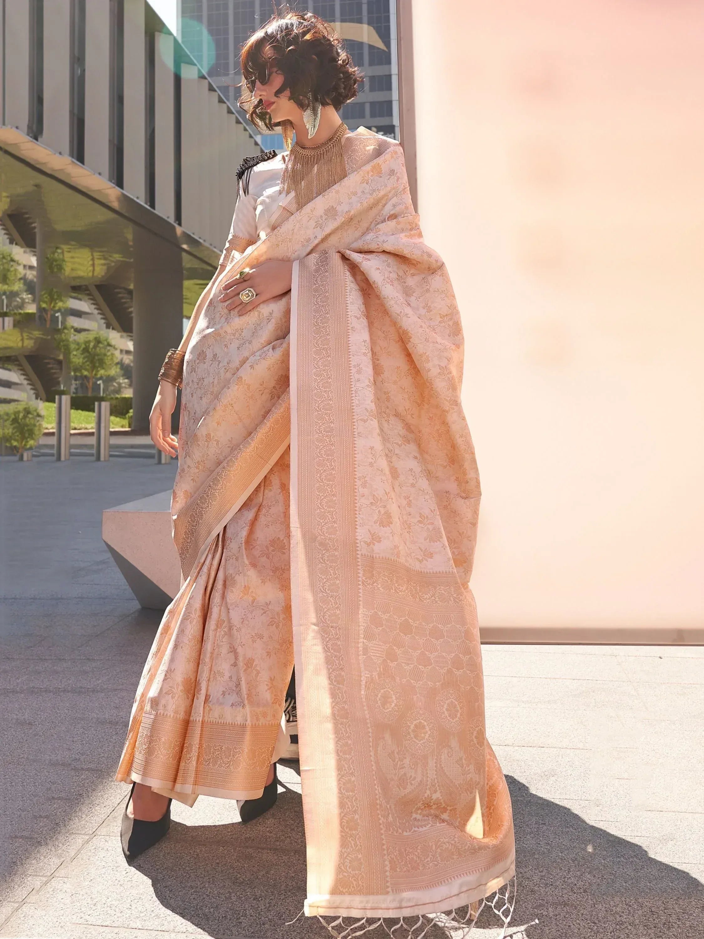 Elegant peach saree with gold floral print, perfect for Indian ethnic wear occasions