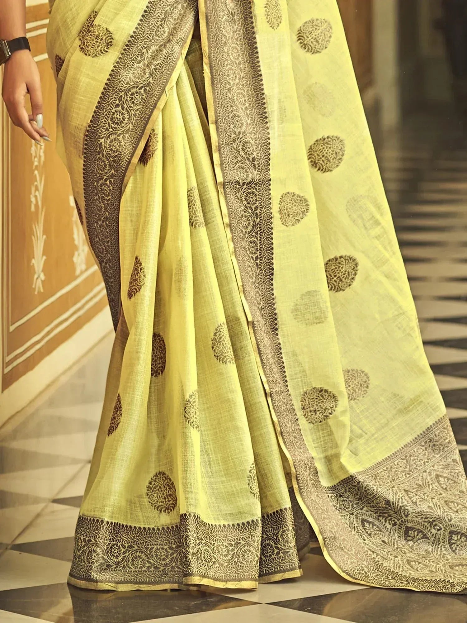 Light yellow saree with brown floral print and intricate border, elegant ethnic wear for women