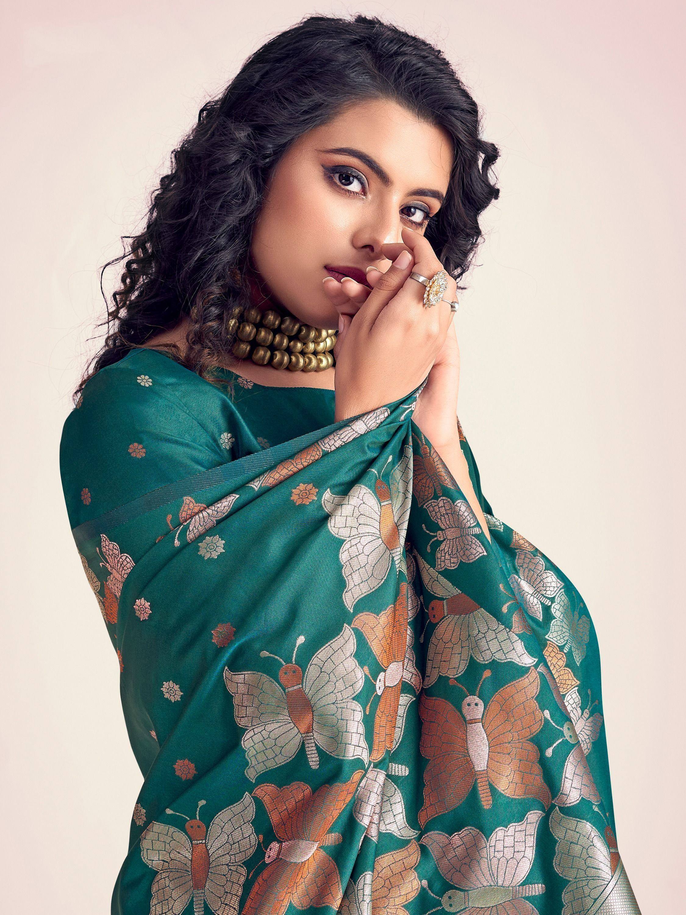 Woman in green butterfly print saree with gold jewelry, Indian ethnic wear