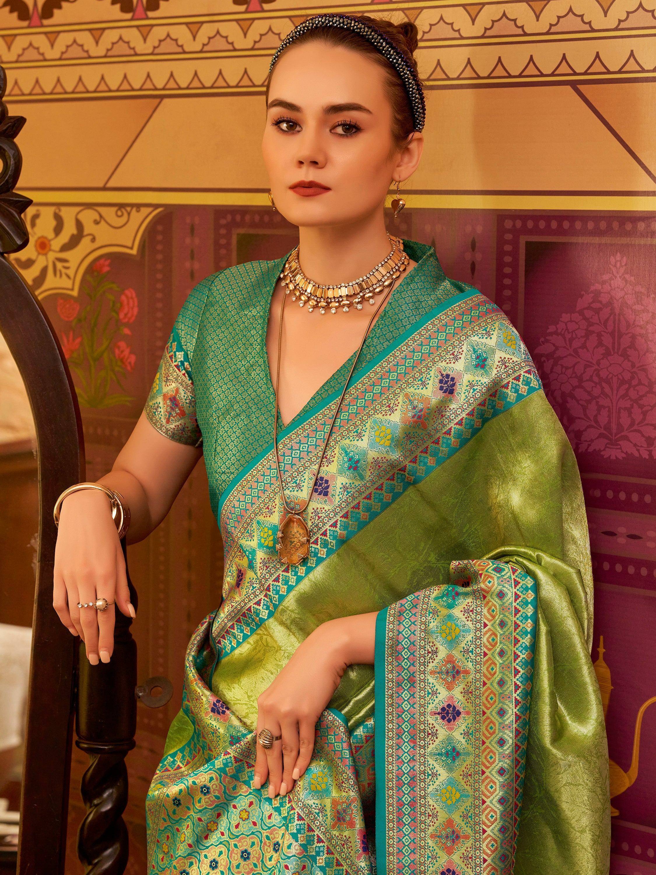 Elegant green saree with intricate floral patterns and traditional jewelry for ethnic wear