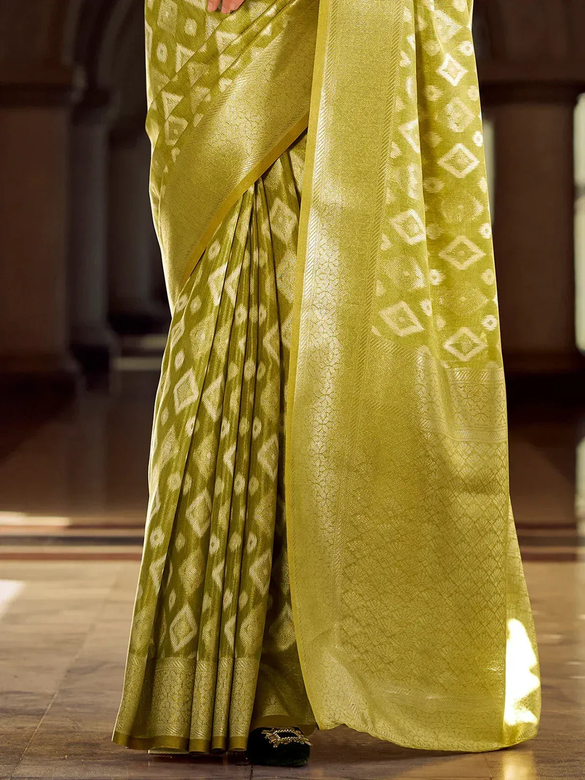 Olive green ethnic saree with white geometric print, perfect for Indian occasions and festive wear.