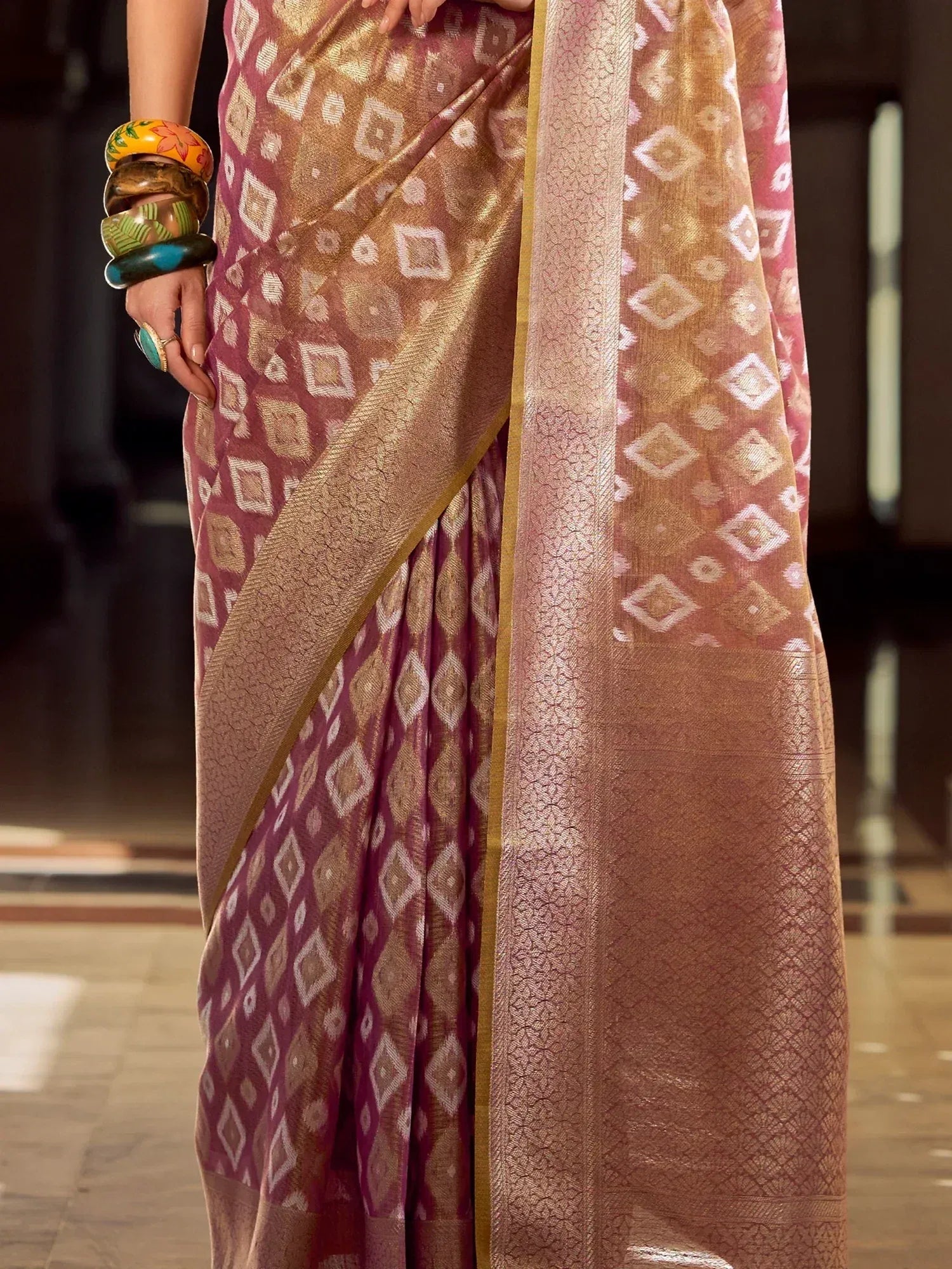 Elegant maroon and gold ikat saree with geometric pattern, perfect for Indian ethnic wear occasions
