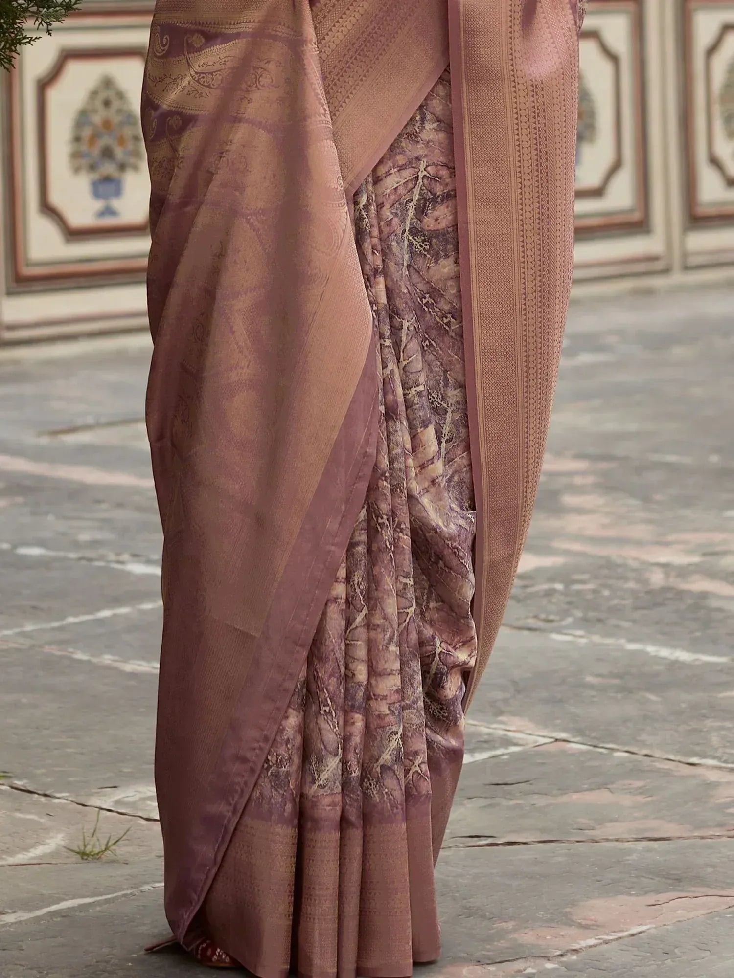 Elegant mauve saree with intricate paisley and floral motifs, perfect for Indian ethnic wear occasions.