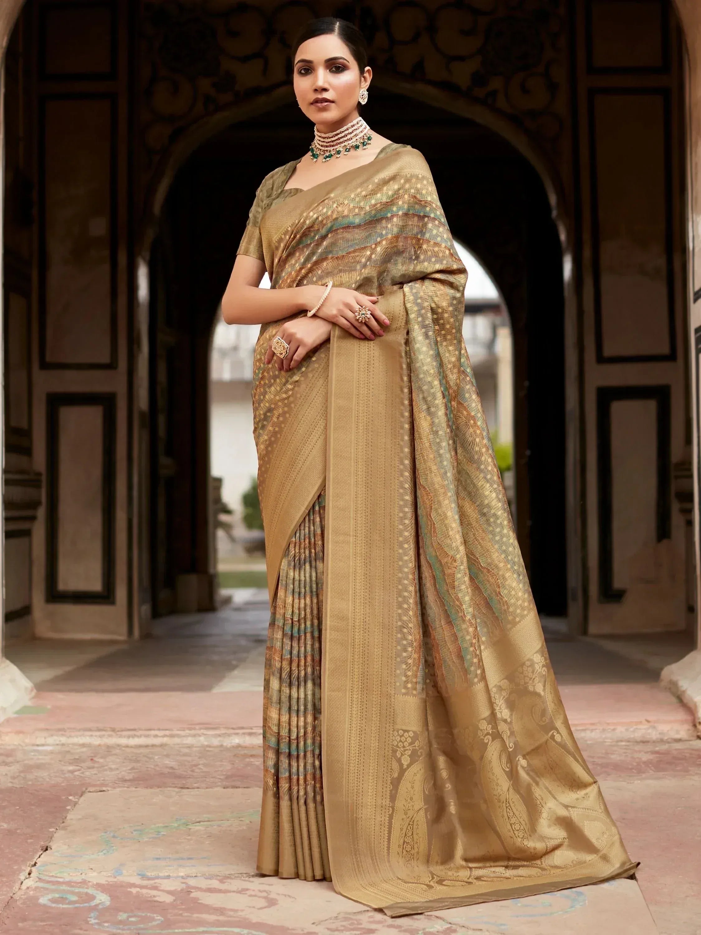 Elegant gold designer saree with intricate patterns, perfect for Indian ethnic wear occasions