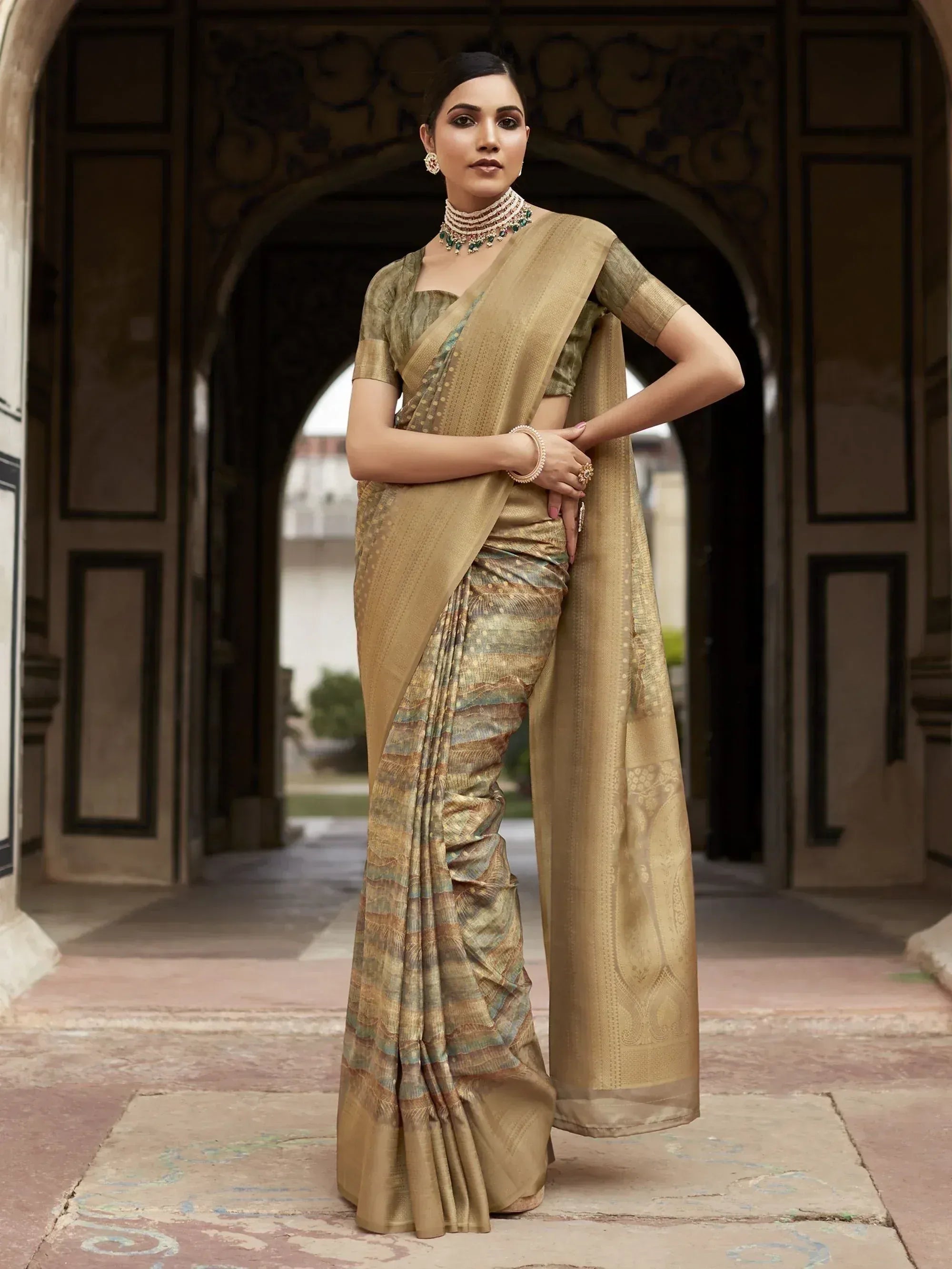 Elegant gold and green designer saree with intricate patterns, perfect for Indian ethnic wear occasions