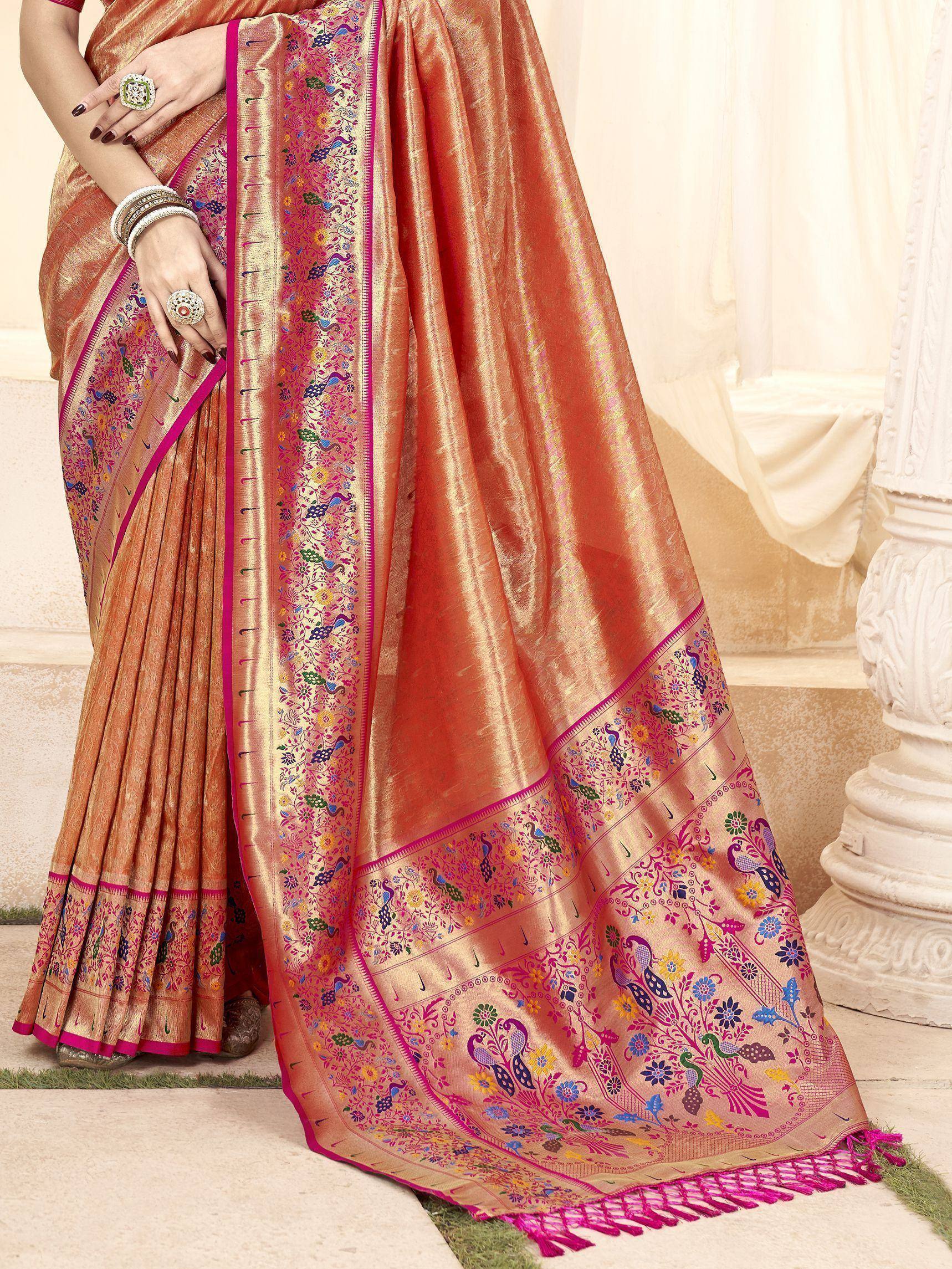 Elegant peach silk saree with peacock and floral embroidery, perfect for Indian ethnic wear occasions.