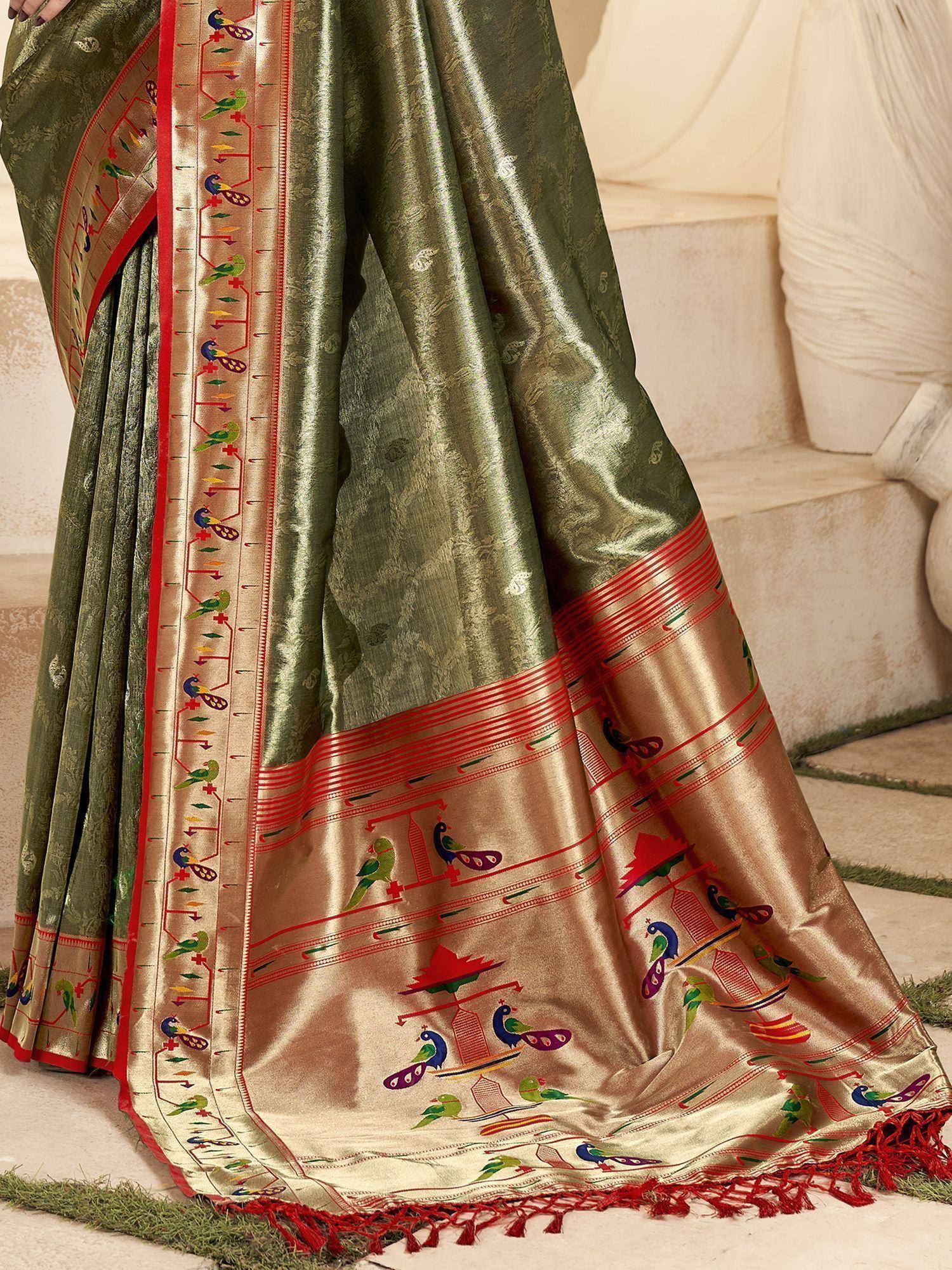 Olive green silk saree with peacock and temple motifs, red border, and tassels for Indian ethnic wear