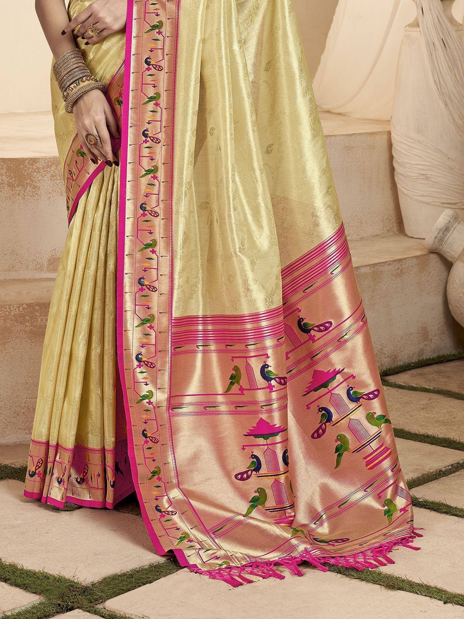 Golden saree with pink border and bird motifs, ethnic Indian wear for festive occasions