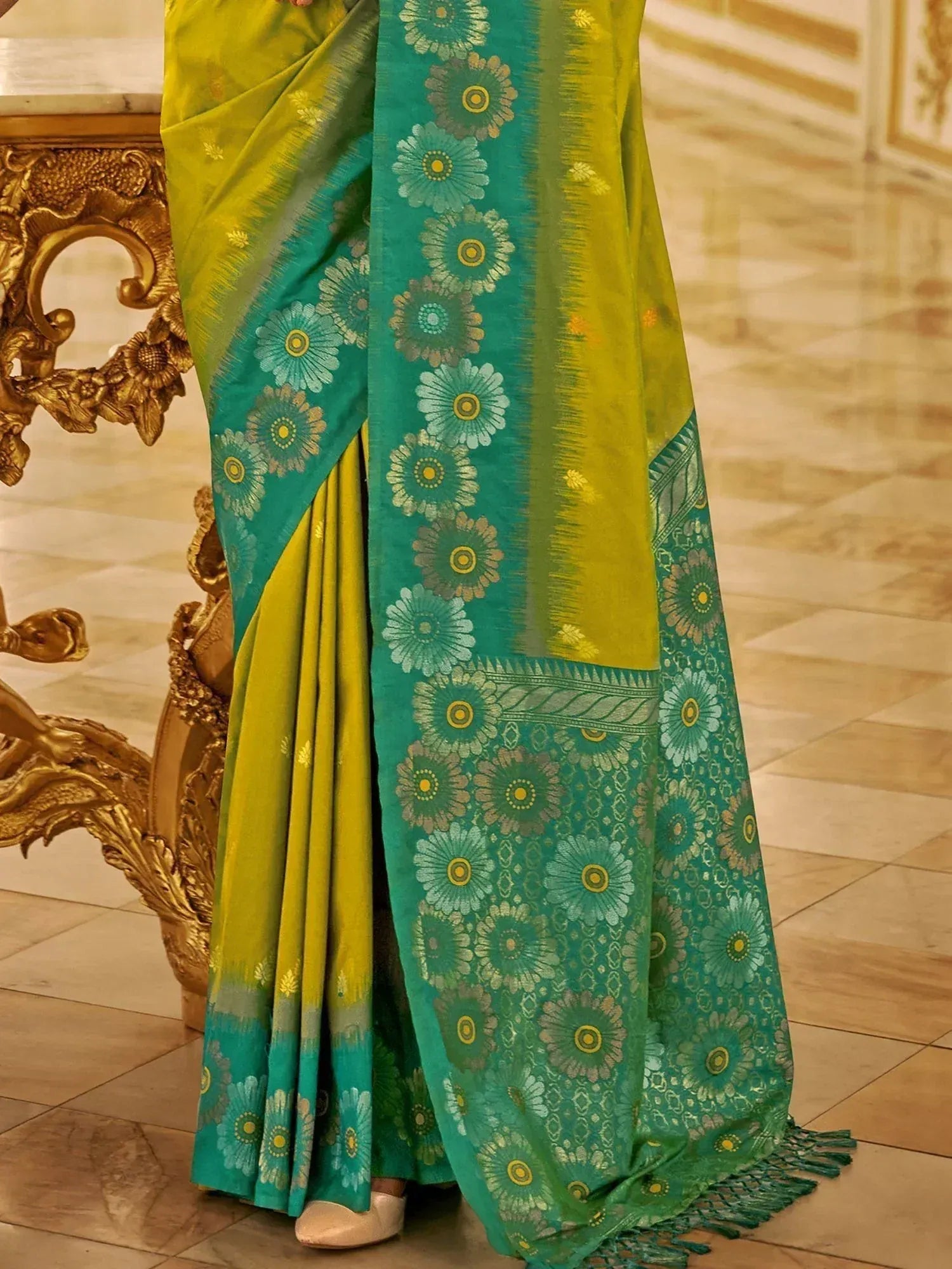 Vibrant green and yellow floral print saree with intricate border, perfect for ethnic occasions