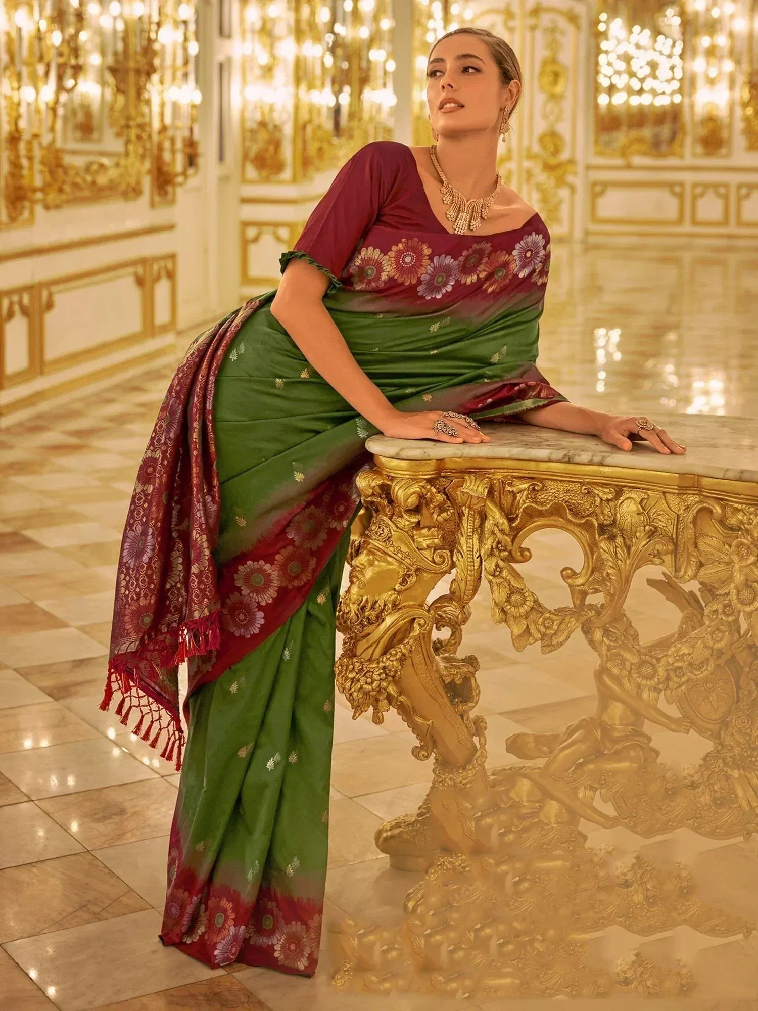 Elegant green and maroon floral saree with gold accents, styled for Indian ethnic wear occasions