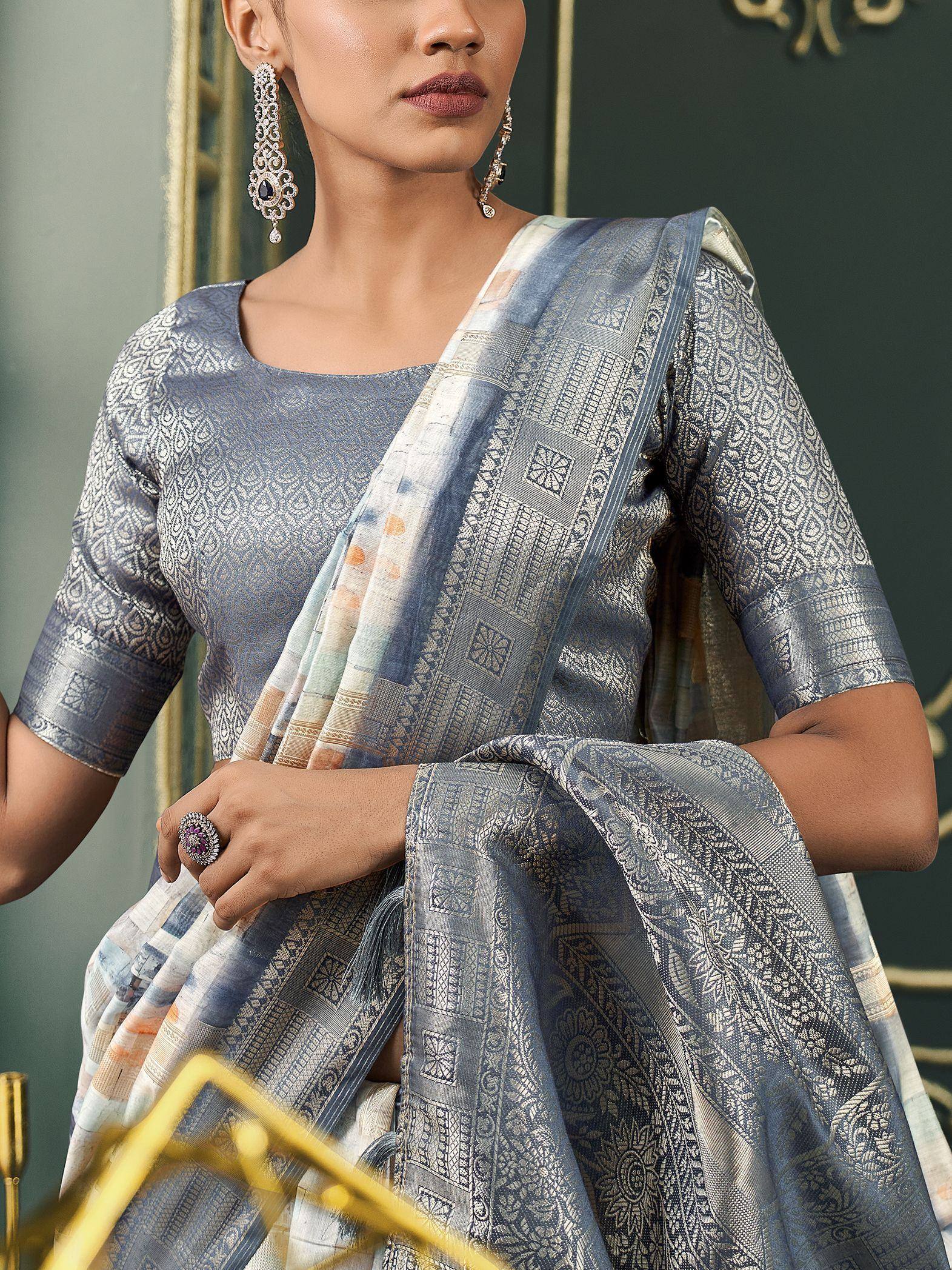 Elegant blue designer saree with intricate silver embroidery and matching blouse, perfect for Indian ethnic occasions.