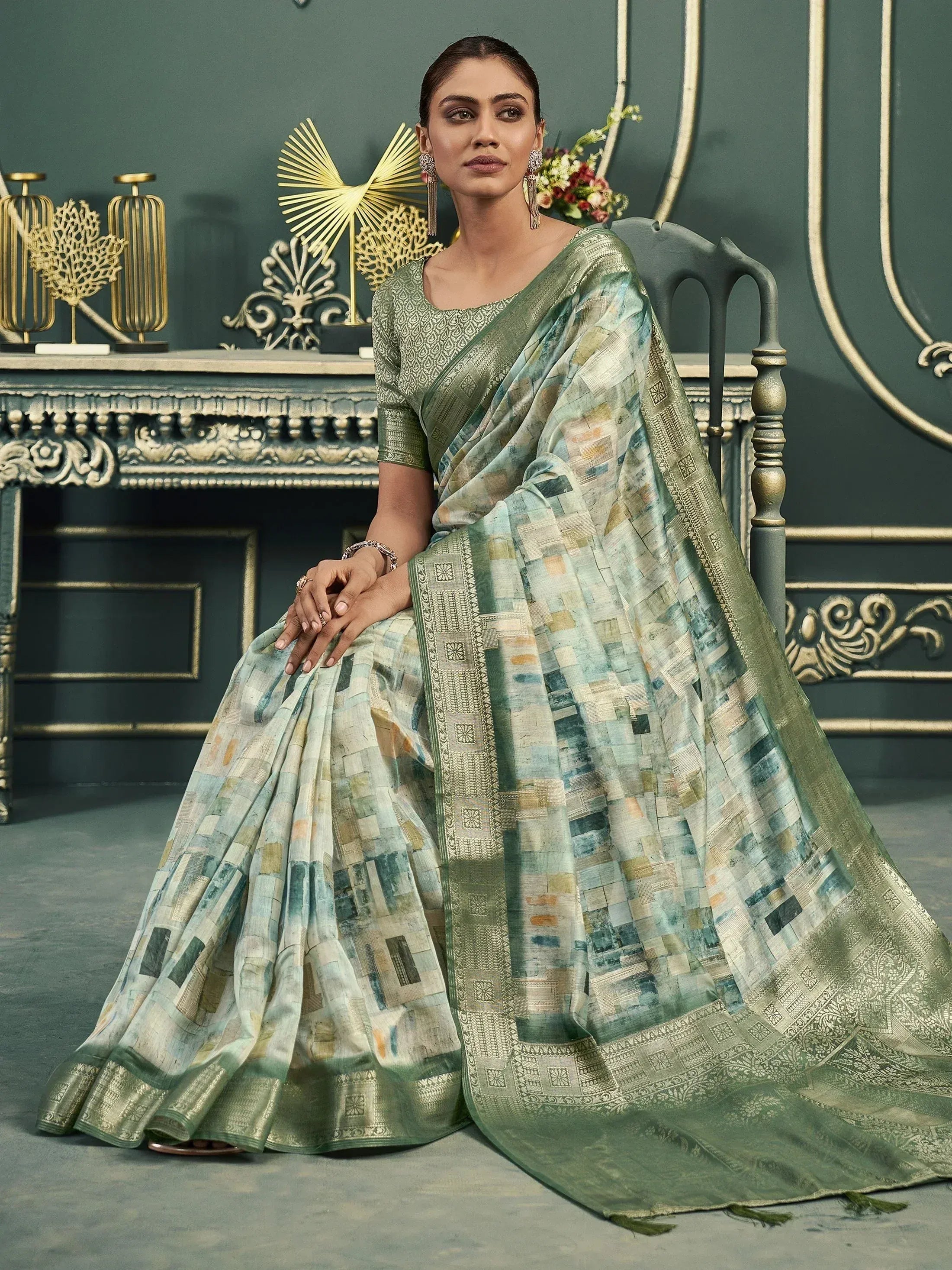 Elegant green printed saree with gold border, perfect for Indian ethnic wear occasions